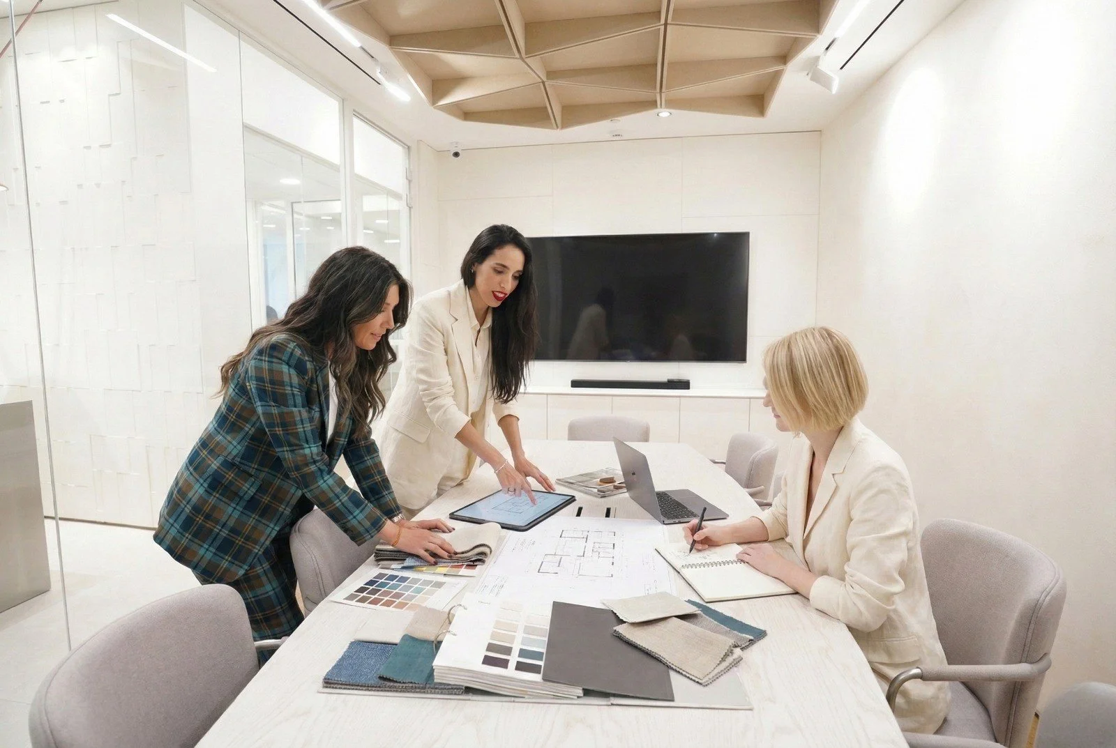 Architectural and interior design team discussing project plans and material selections