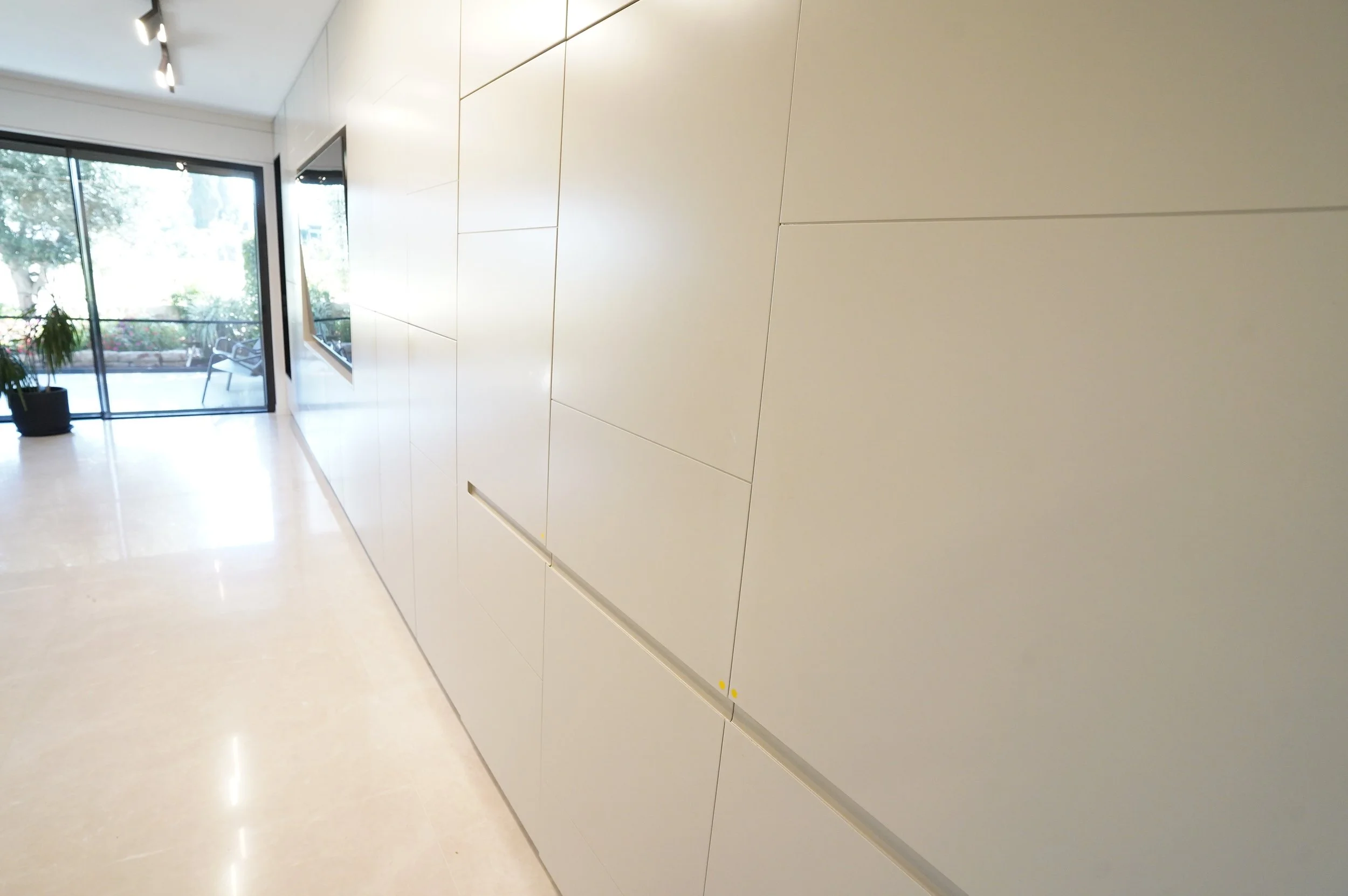 Modern residential living room with custom built-in wall