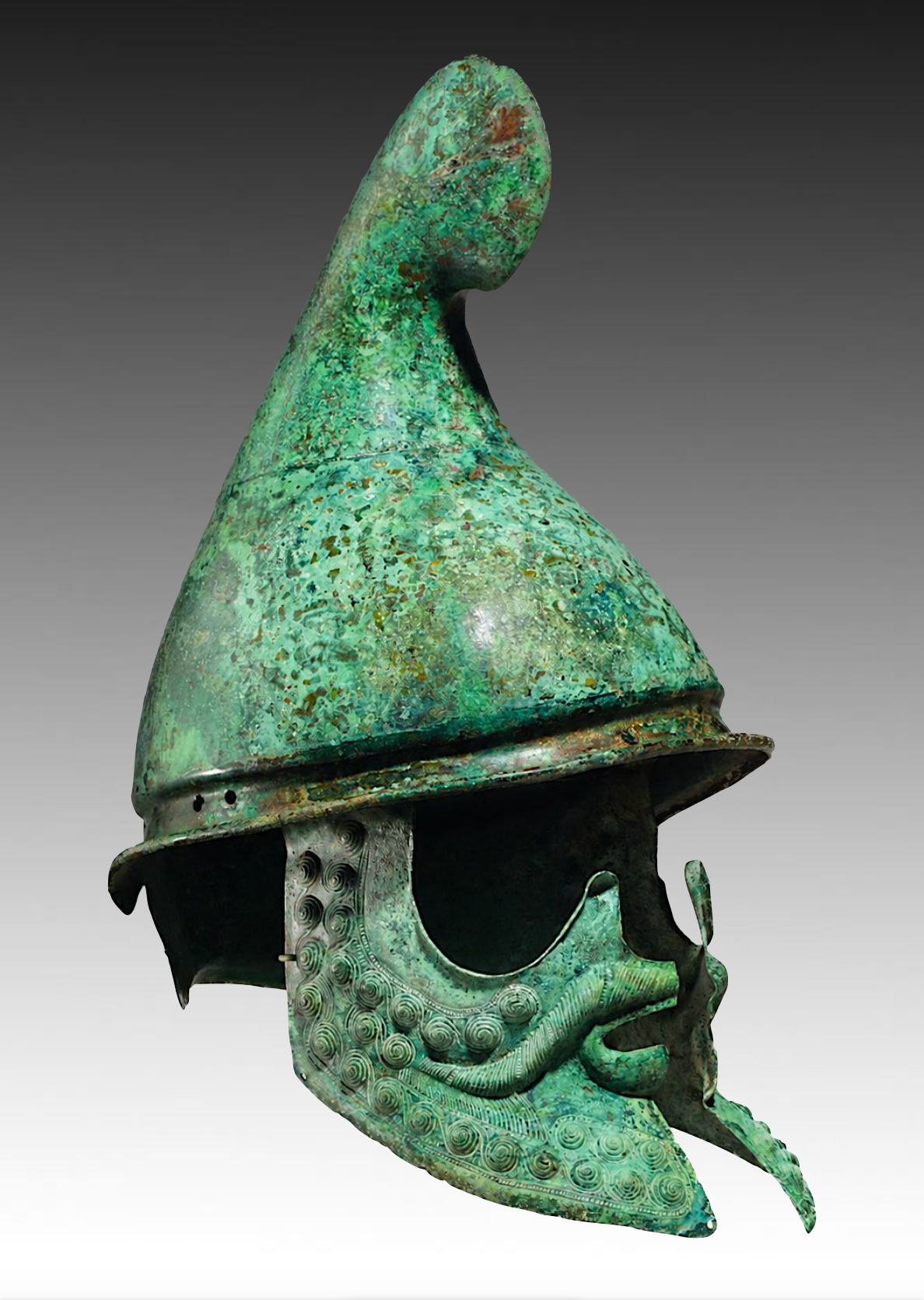 Ancient green metallic Helm of a warrior, with a dragon or animal crest on top, intricate swirling designs, and an open face guard.