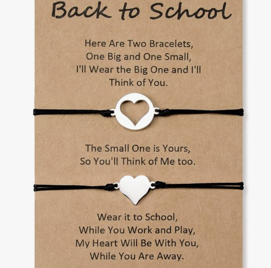 Two bracelets, one with a heart-shaped charm and one with a round-shaped charm, on a brown card with a back-to-school poem.