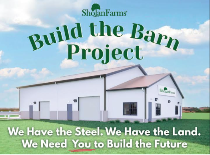 A white barn with a grey roof and large windows, set against a partly cloudy sky; promotional poster for Sholan Farms' Build the Barn Project.