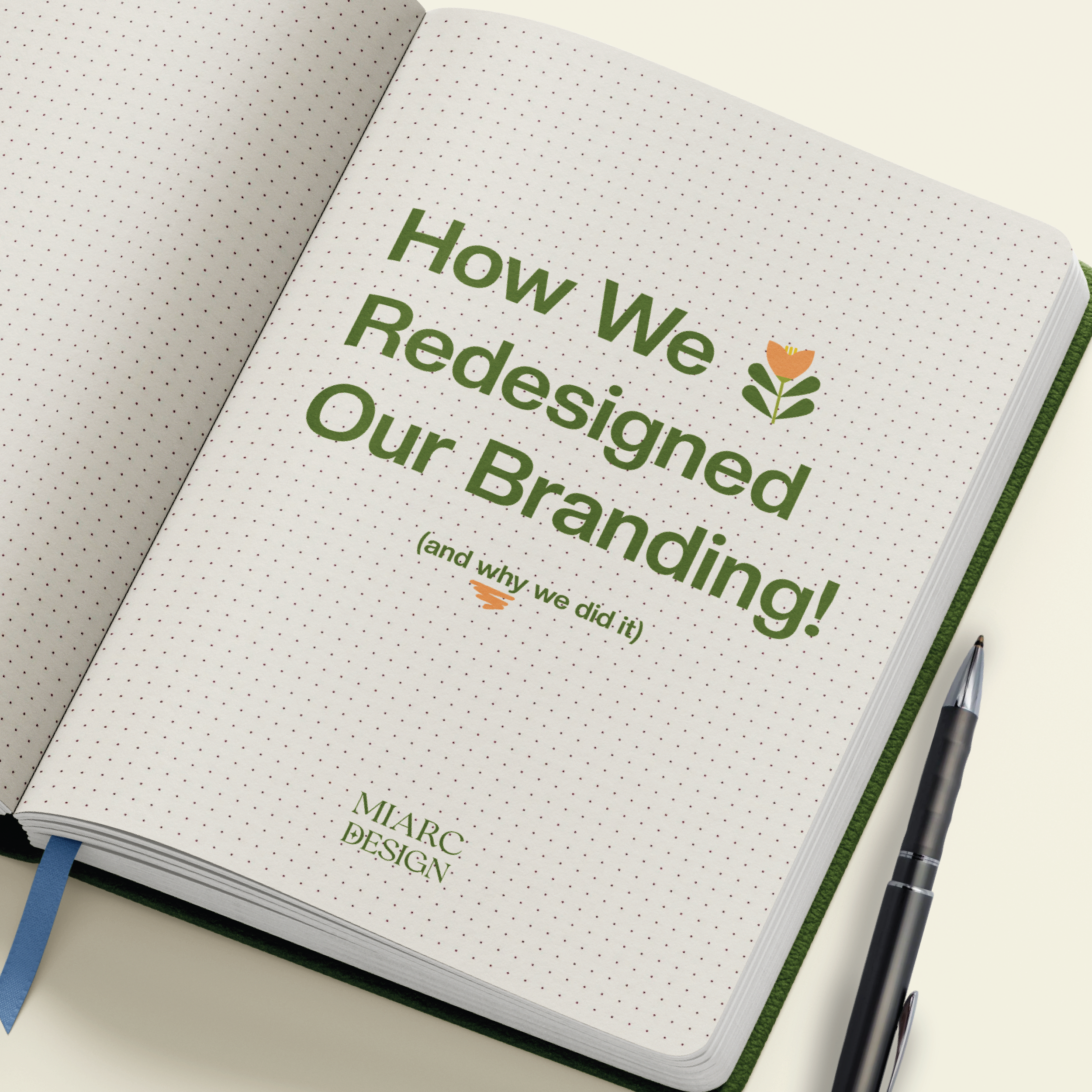 Open notebook with a page titled 'How We Redesigned Our Branding!' in green text, with a small flower illustration, and the subtitle '(and why we did it)' underneath. A black pen is placed beside the notebook.