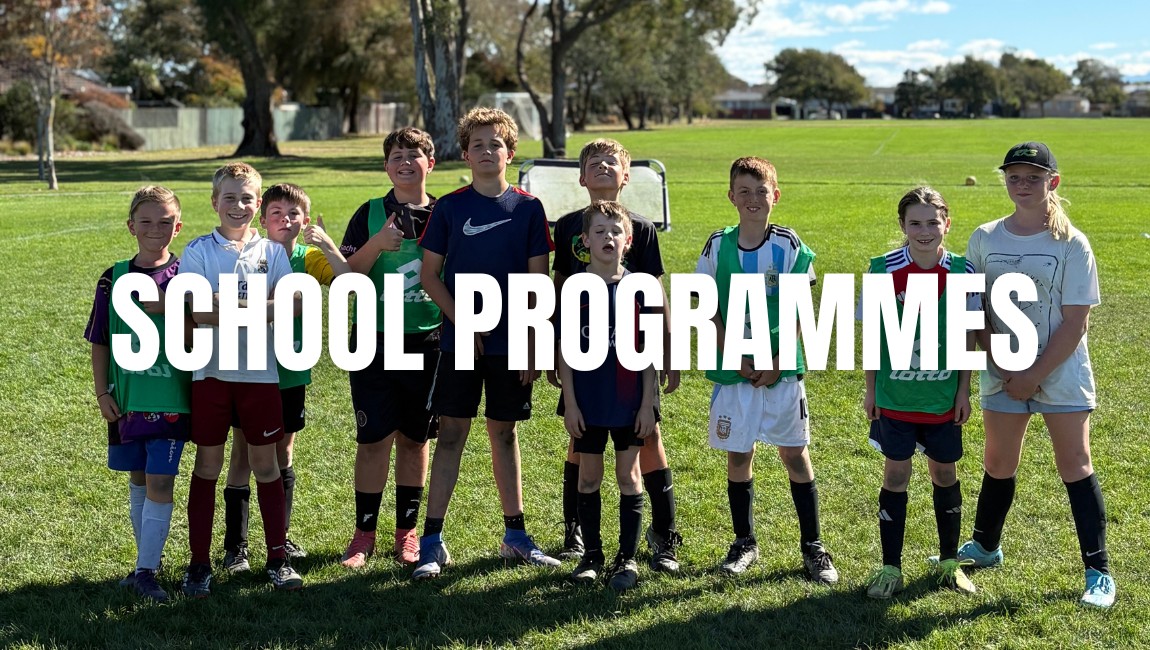 Young children in sports uniforms standing on a grassy field with trees and open sky in the background, with a large text overlay reading 'SCHOOL PROGRAMMES'.