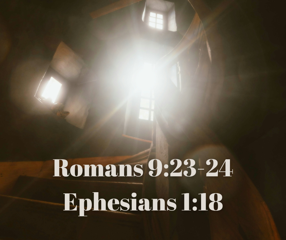 Bright sunlight shining through small windows in a wooden attic or upper room. Overlaid text cites Bible verses Romans 9:23-24 and Ephesians 1:18.