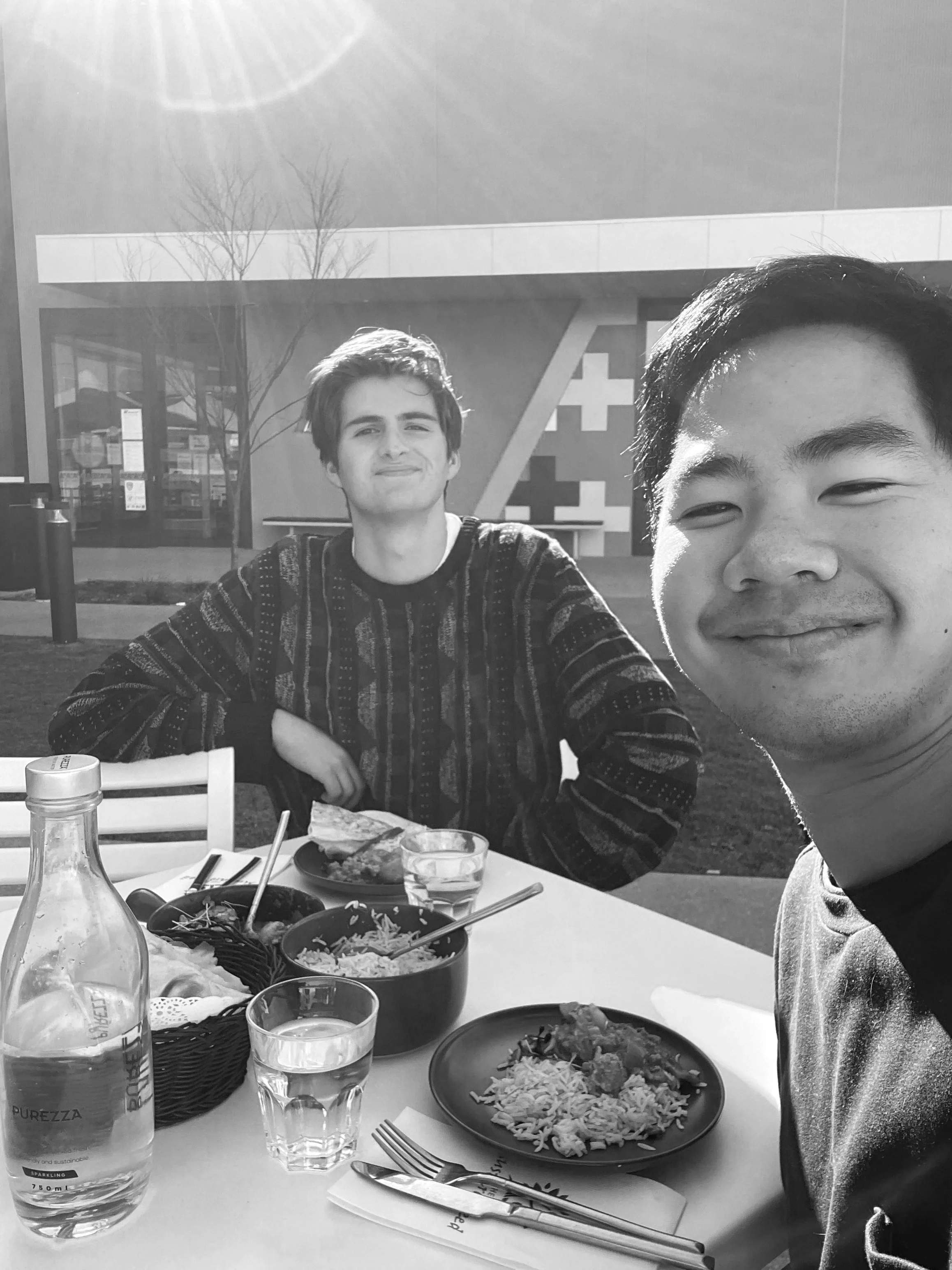 Joel Chan and Luke Howis sharing a meal — the ordinary moments of friendship from which songs of worship were born.