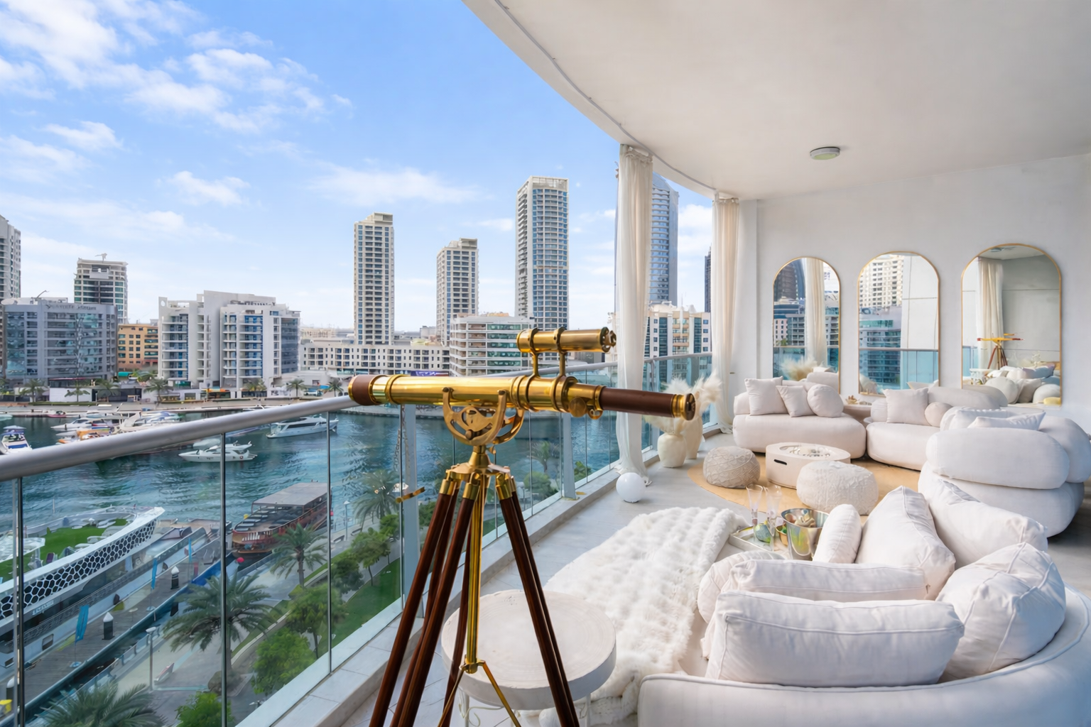 Luxury living room with white sofas, round mirrors, a telescope, and a city view of tall buildings and a marina.
