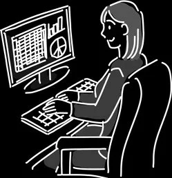 Person sitting at a desk working on a computer with multiple monitors displaying charts and data.