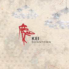 Logo with red dragon and the words "KEL DOWNTOWN" on a textured background.