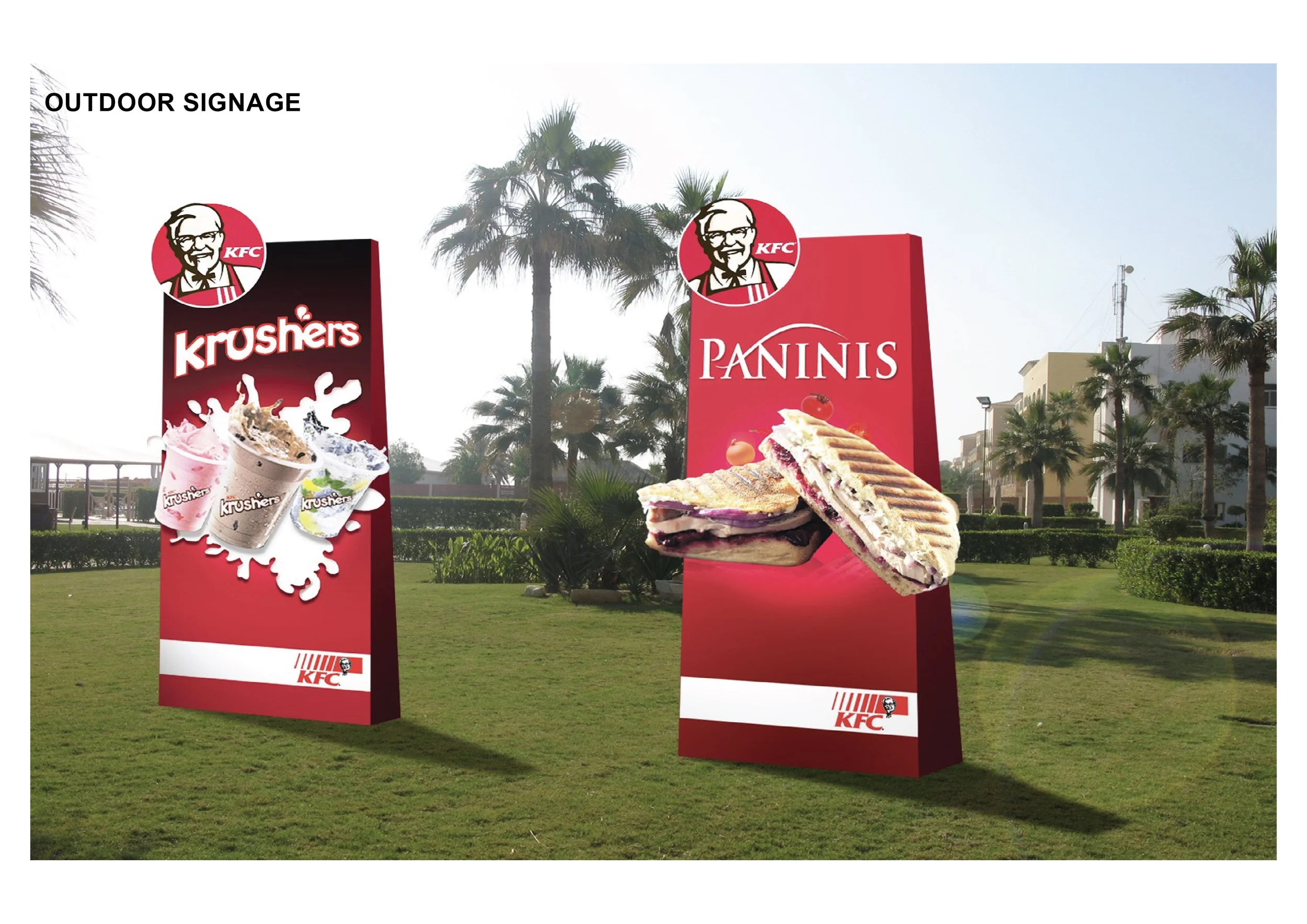 Outdoor KFC signage displays Krushers drinks and panini sandwiches, with KFC logo and palm trees in the background.