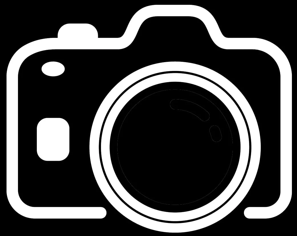 Black and white icon of a camera with a large lens in the center.