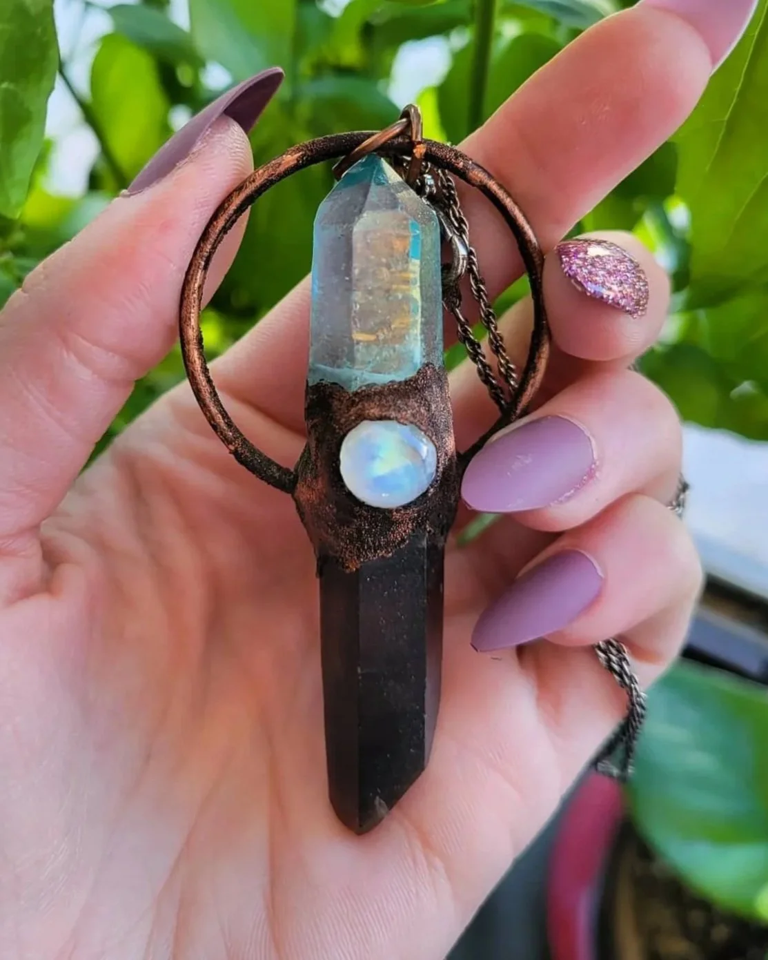 Copper wrapped aqua aura & smoky quartz pendant centered with a flashy moonstone.
