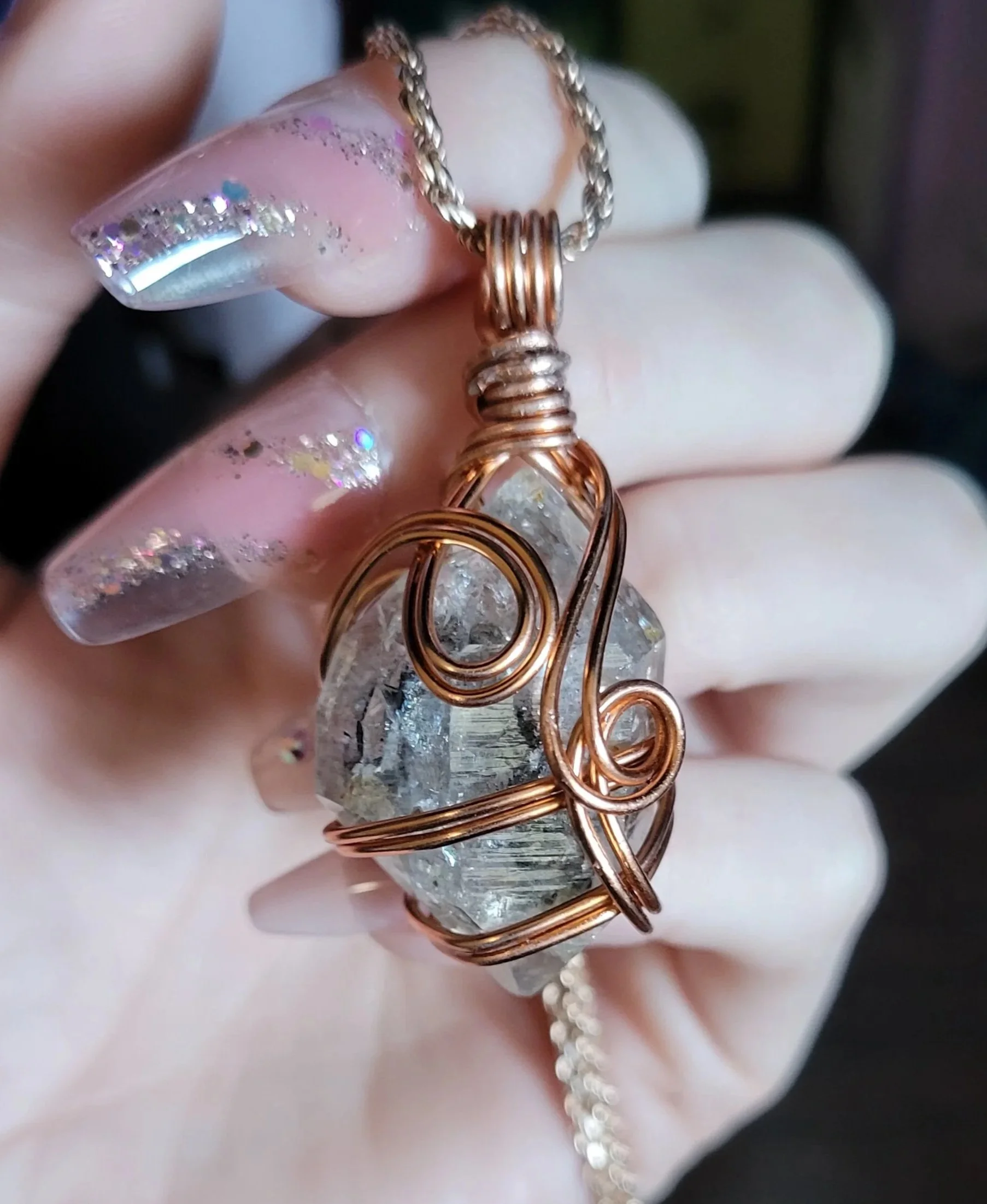 Copper wrapped Herkimer diamond pendant.