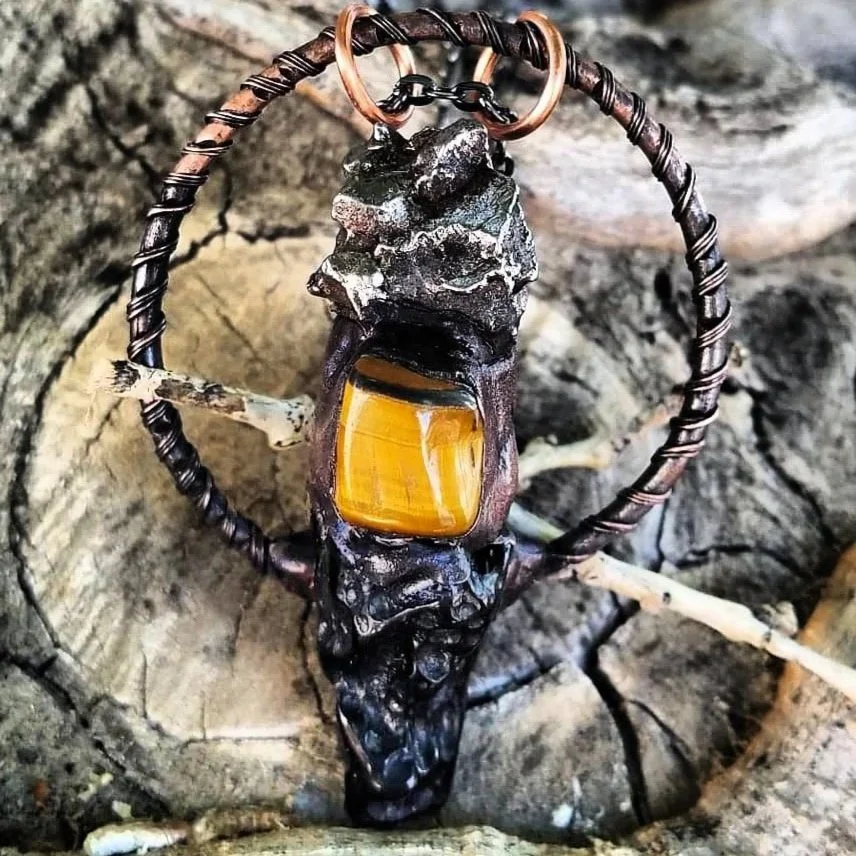 Copper wrapped meteorite with tektite and tigers eye pendant.