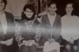 Photograph of Stacy Grove Meyer, also known as Stacy Moxon. Stacy is pictured second from the left during her time at Gold Base located in Hemet California.