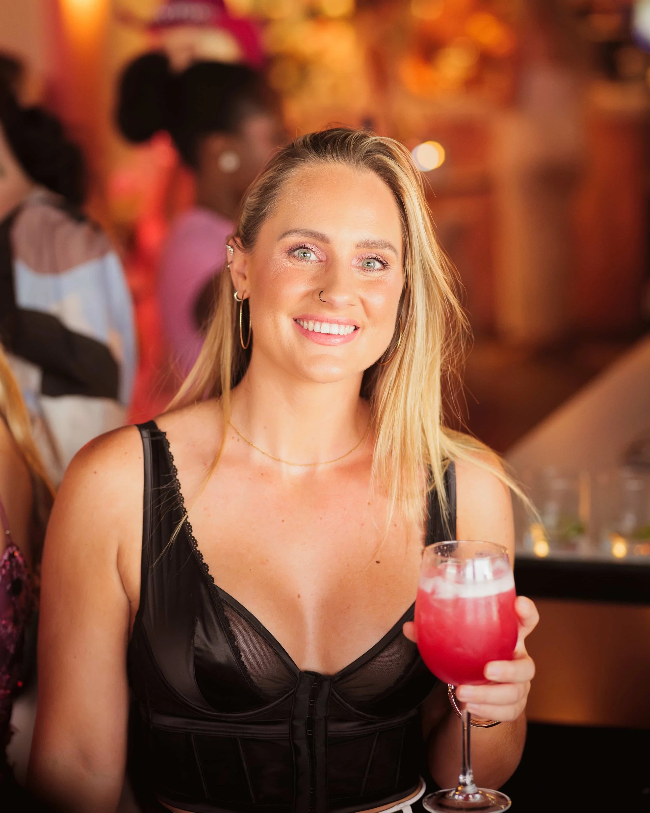 girl holding cocktail
