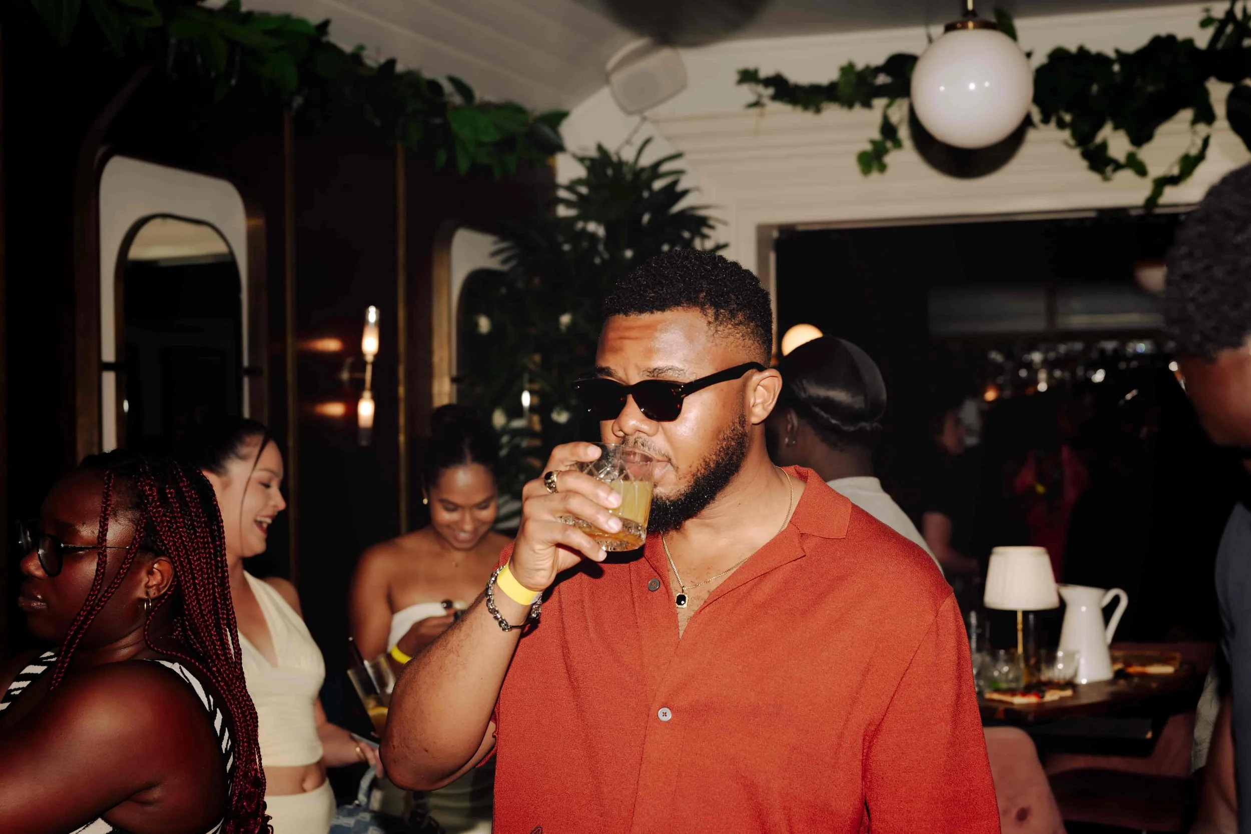 black man drinking in bar