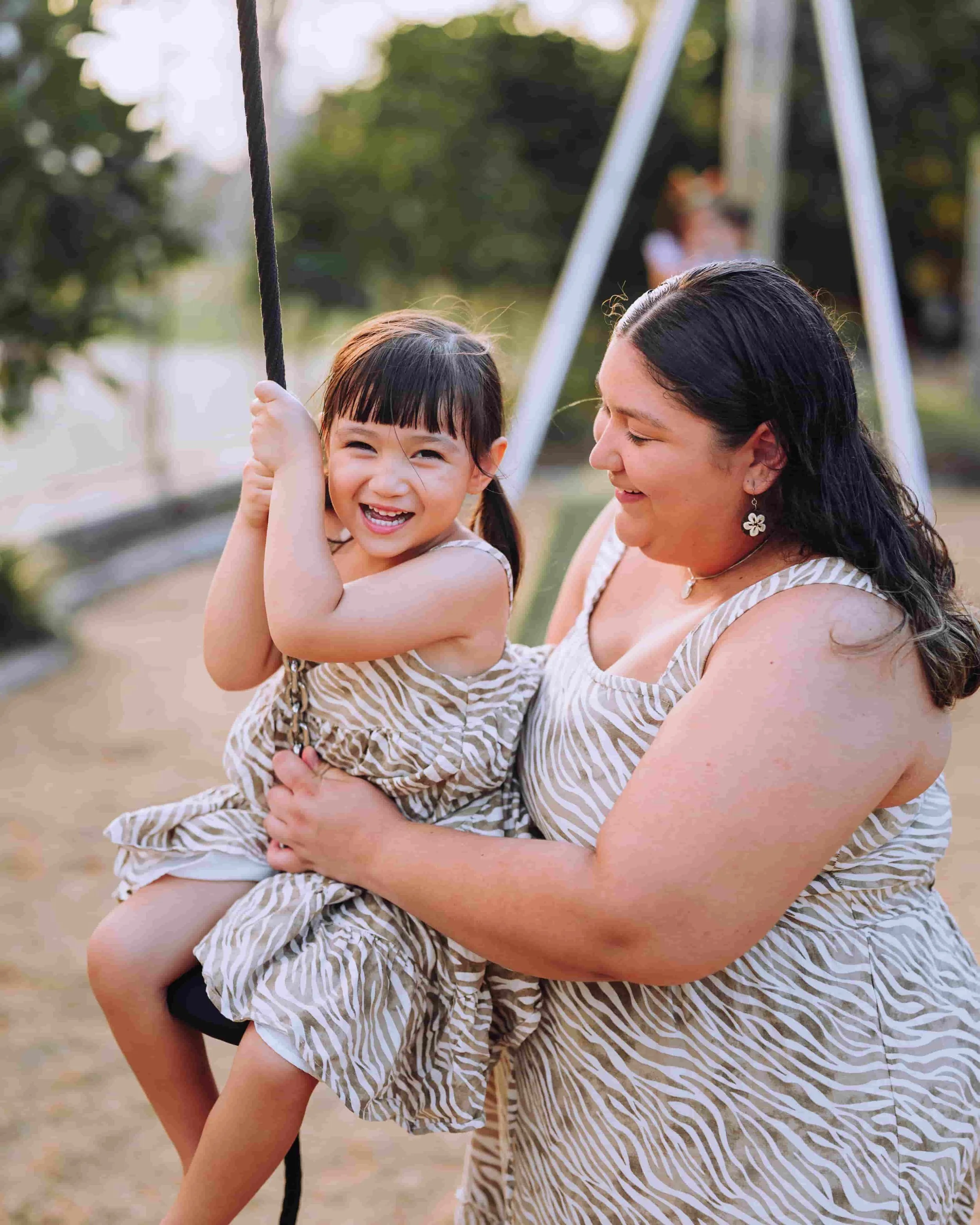 Daughter and mother on a zipline