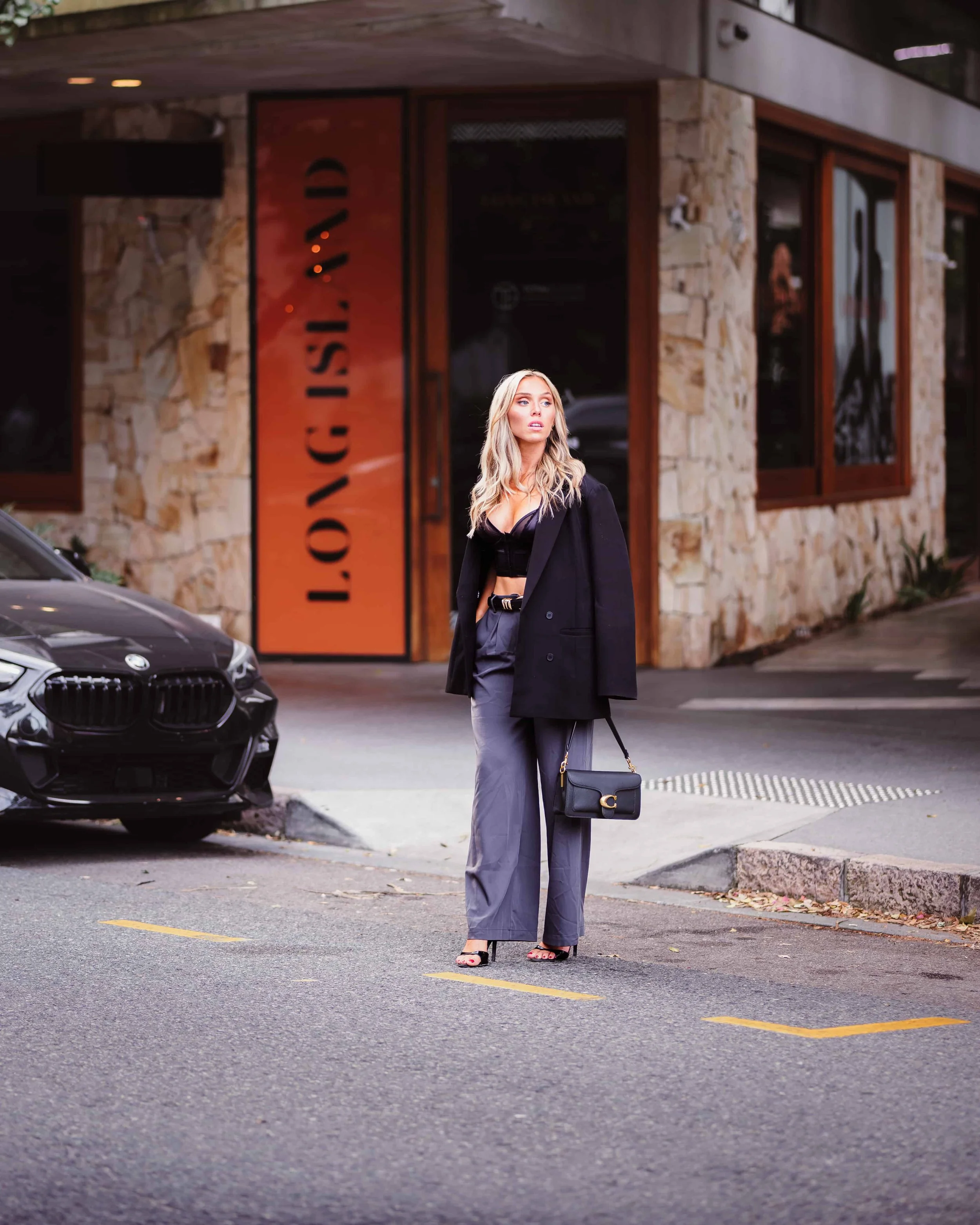 blonde model about to cross the road