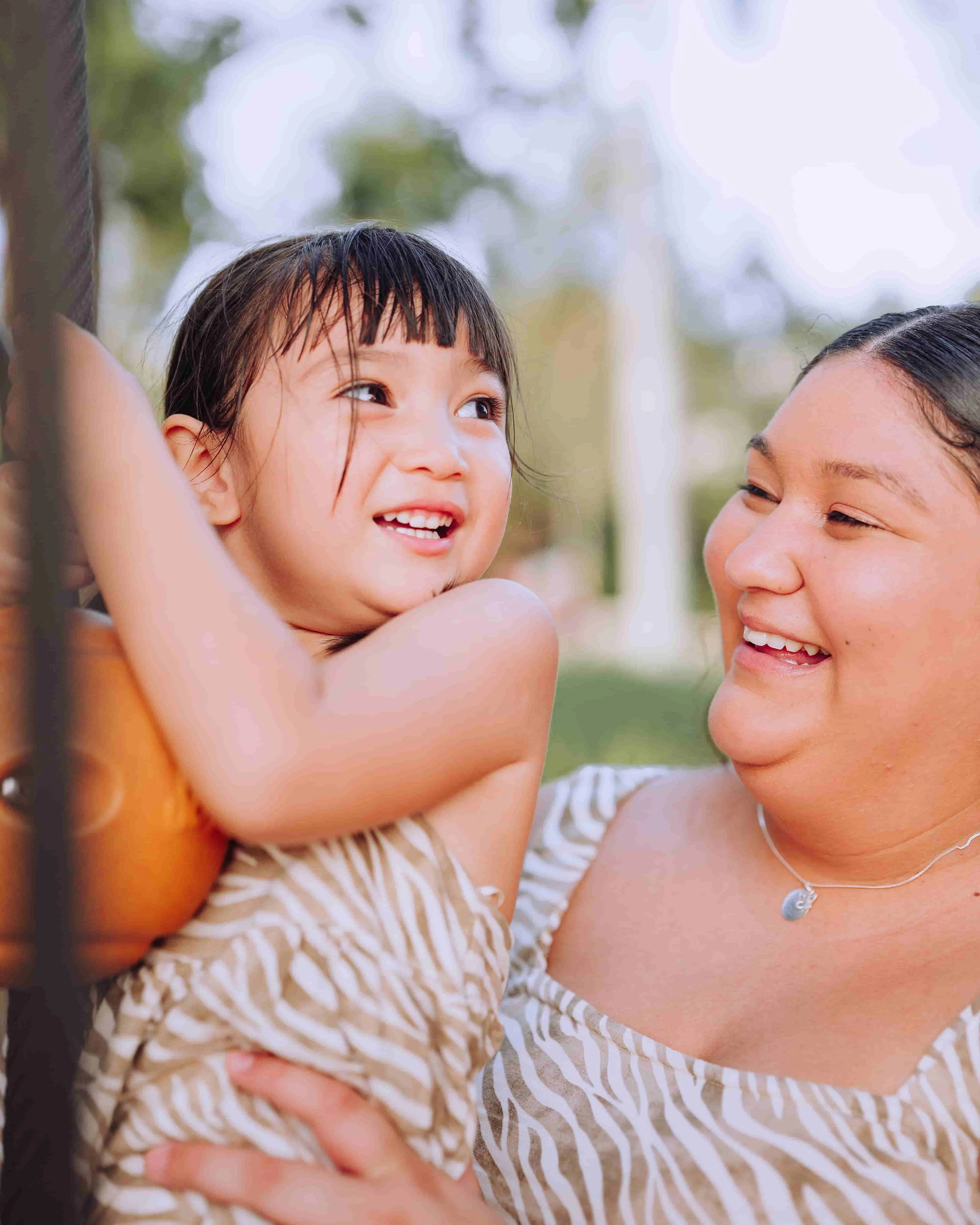 mother and daughter laughing