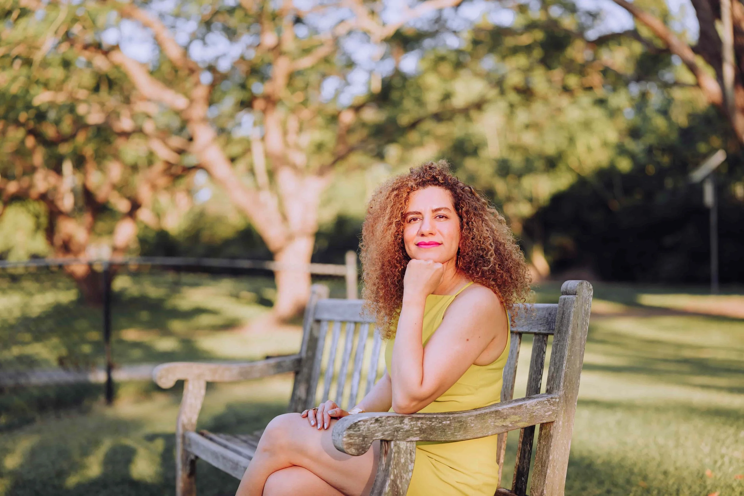 woman sitting on bench in park in brisbane