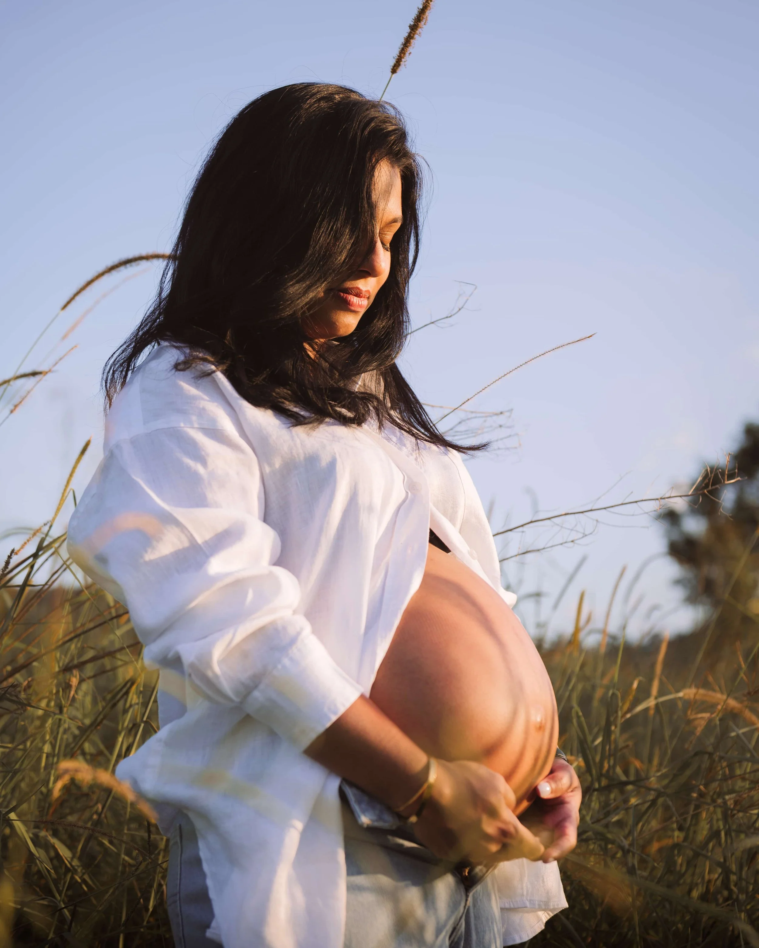 pregnant woman during sunset