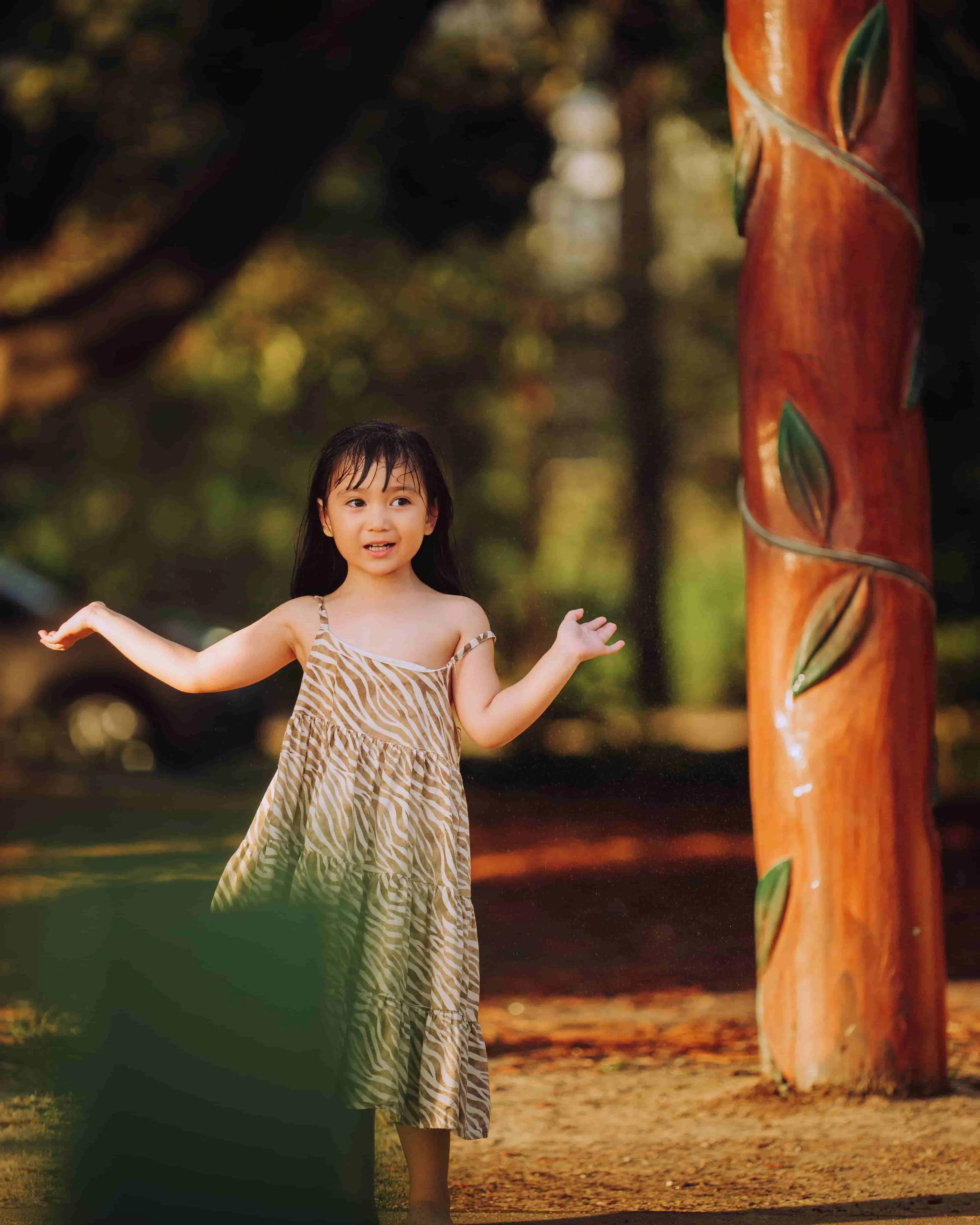 little girl posing during sunset