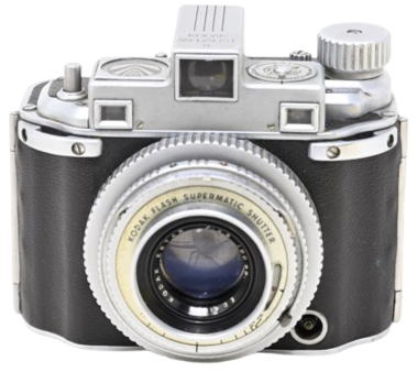 A vintage 35mm film camera with a black and silver body and a large lens.