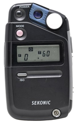 A Sekonic light meter with digital display and various buttons.