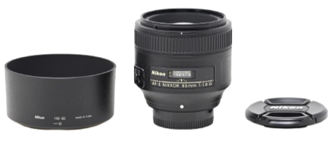 Nikon camera lens with a lens hood and a camera lens cap on a plain background.