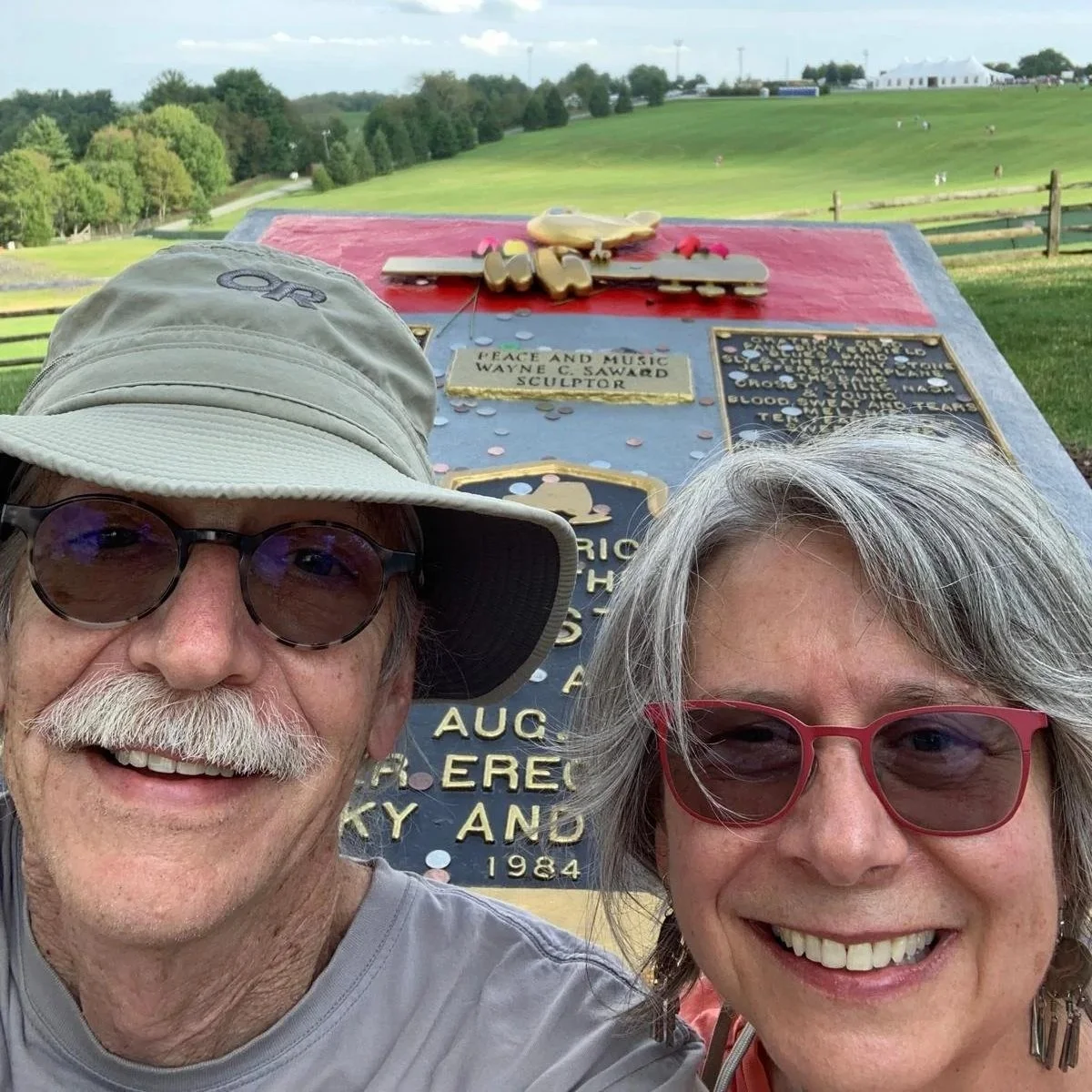 My beautiful wife and I saving a special moment by a music legends memorial.. life is great