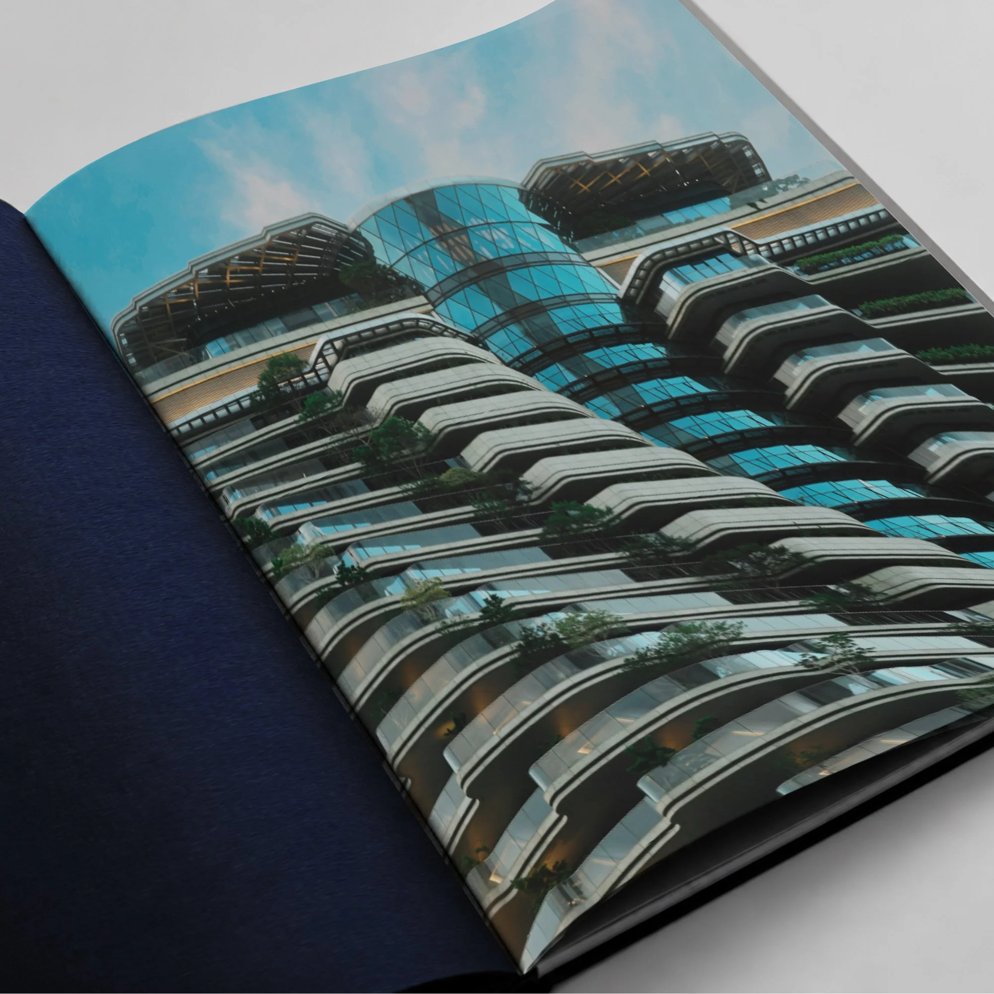Open luxury architectural publication showcasing modern residential tower photography.