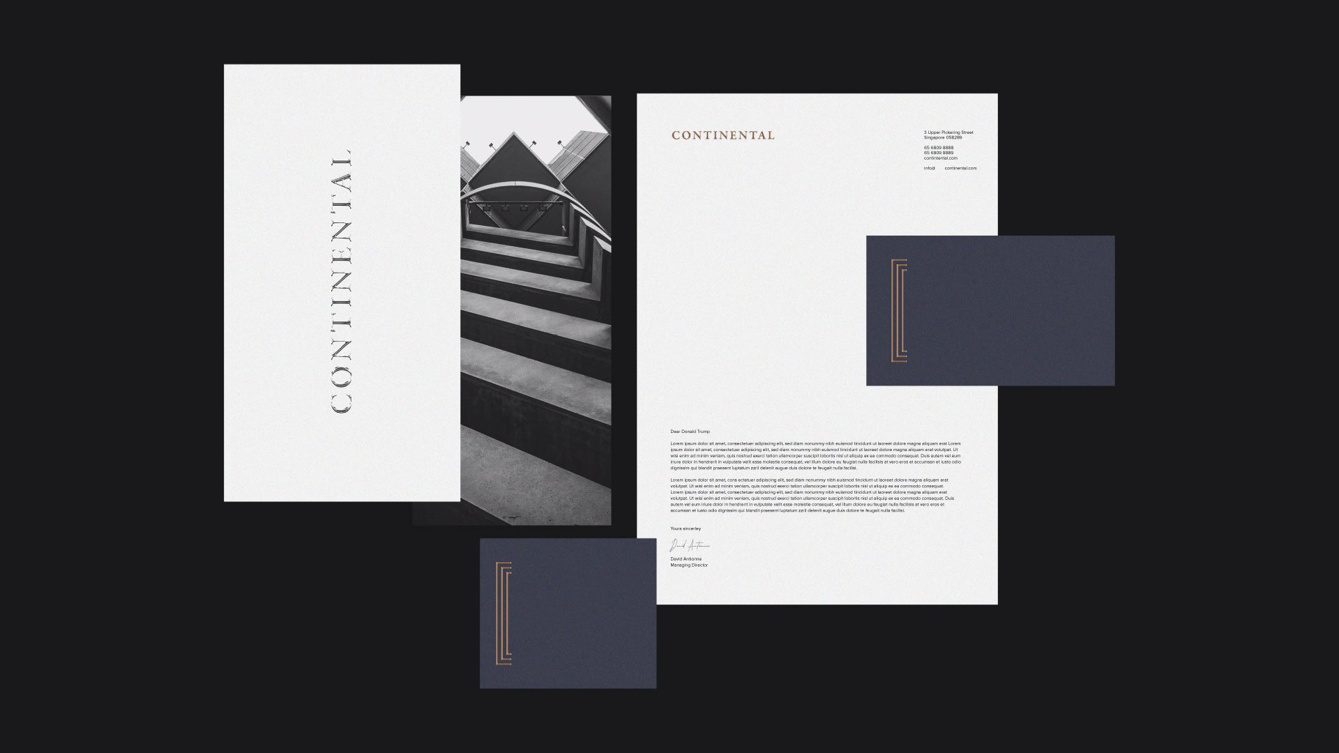 A collection of modern, minimalist business stationery, including a letterhead, business cards, and folder designs, featuring black, white, navy blue, and copper accents, with a staircase photograph included.
