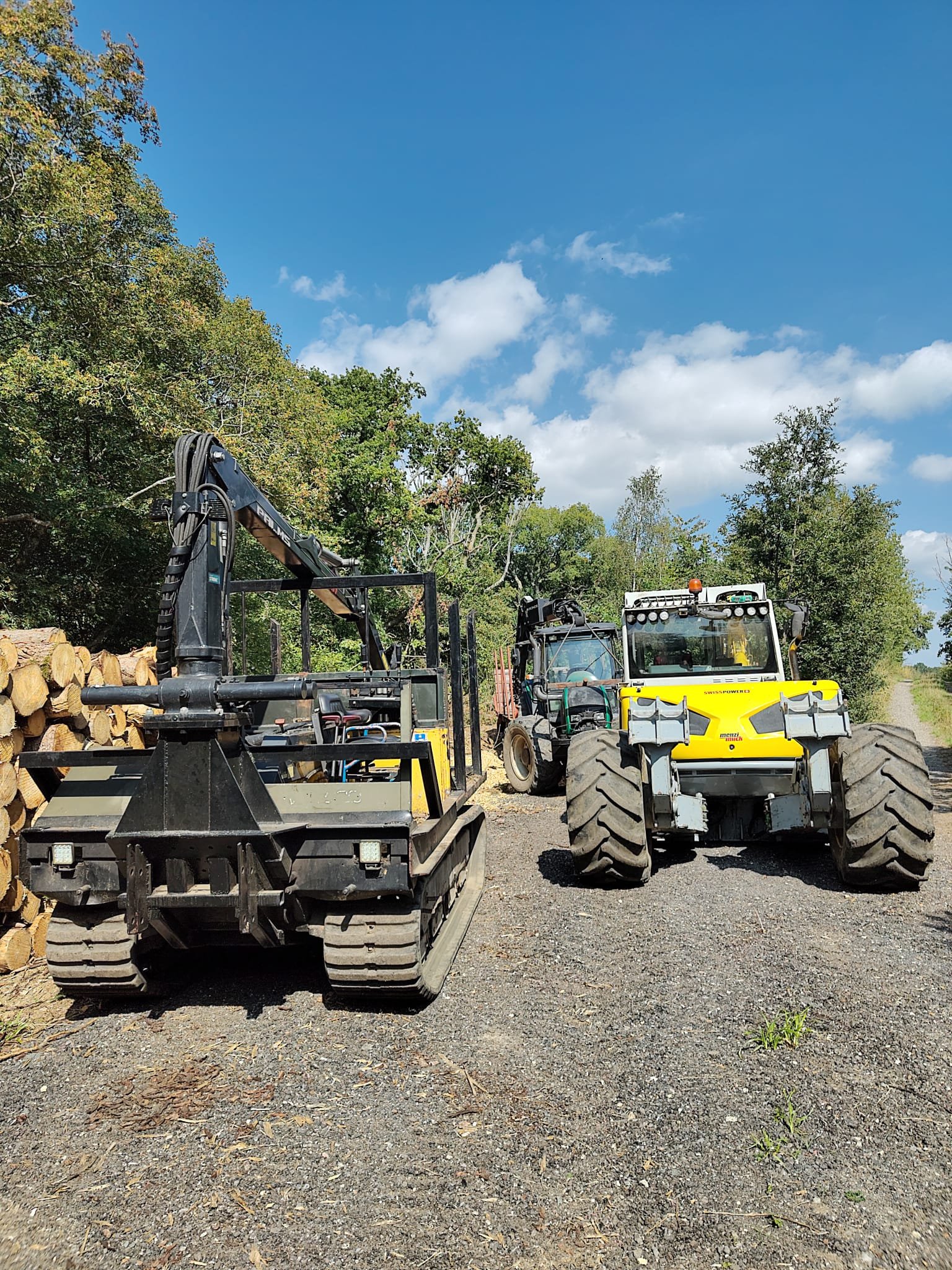 Tracked dumper, Menzi Muck, and Valtra