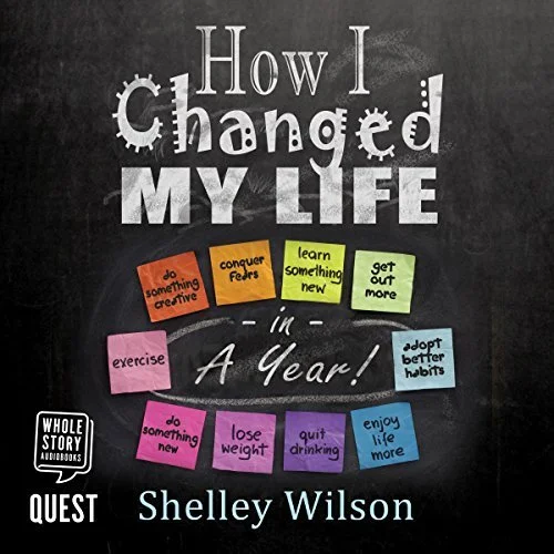 Book cover titled 'How I changed my life in a year' by Shelley Wilson, featuring colorful sticky notes with motivational phrases like 'do something creative,' 'conquer fears,' 'learn something new,' 'get out more,' 'exercise,' 'do something new,' 'lose weight,' 'quit drinking,' and 'enjoy life more.'