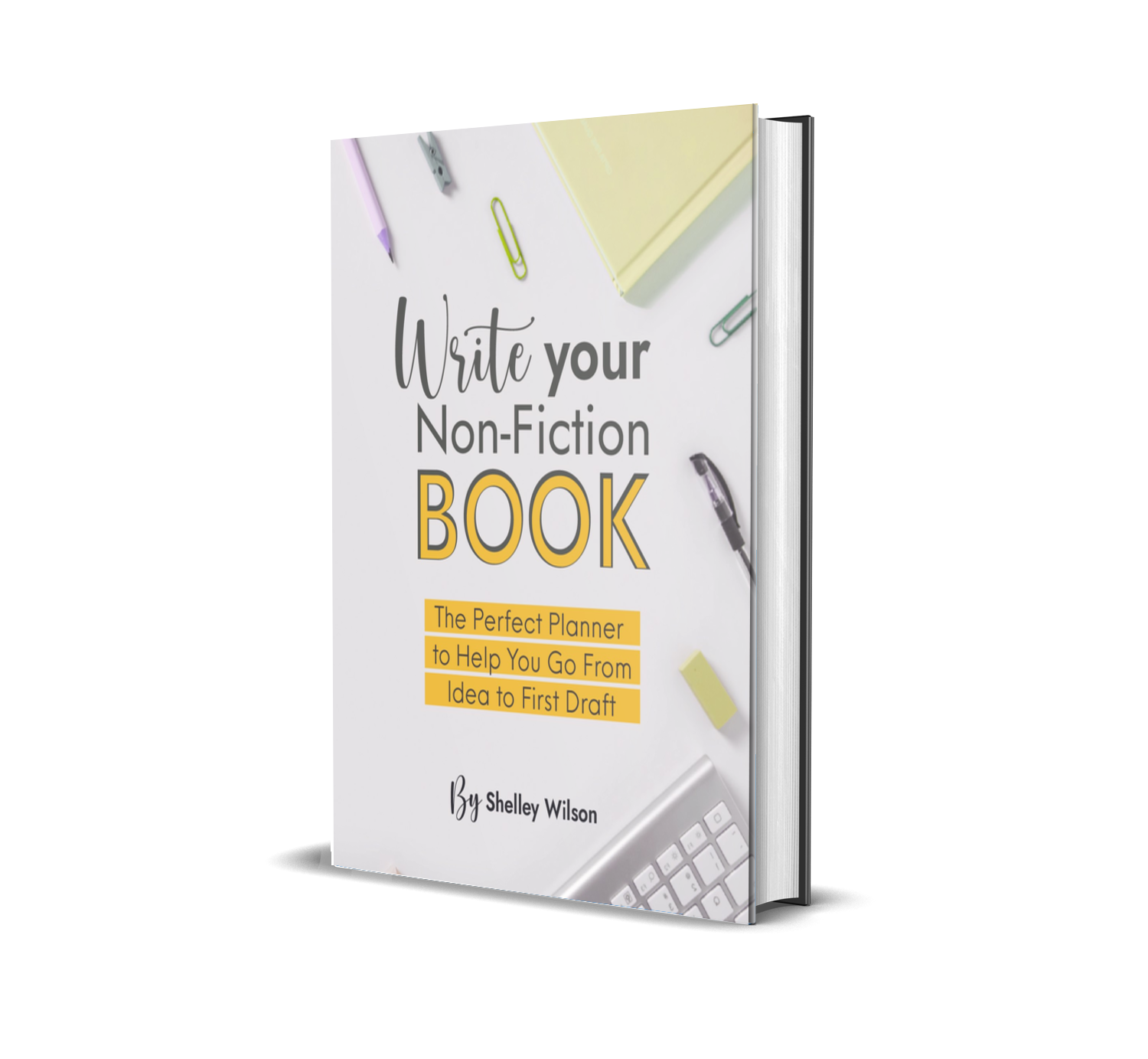 Cover of a book titled "Write Your Non-Fiction Book" by Shelley Wilson, featuring office supplies such as pens, paper clips, sticky notes, a keyboard, and a notepad on a white background.
