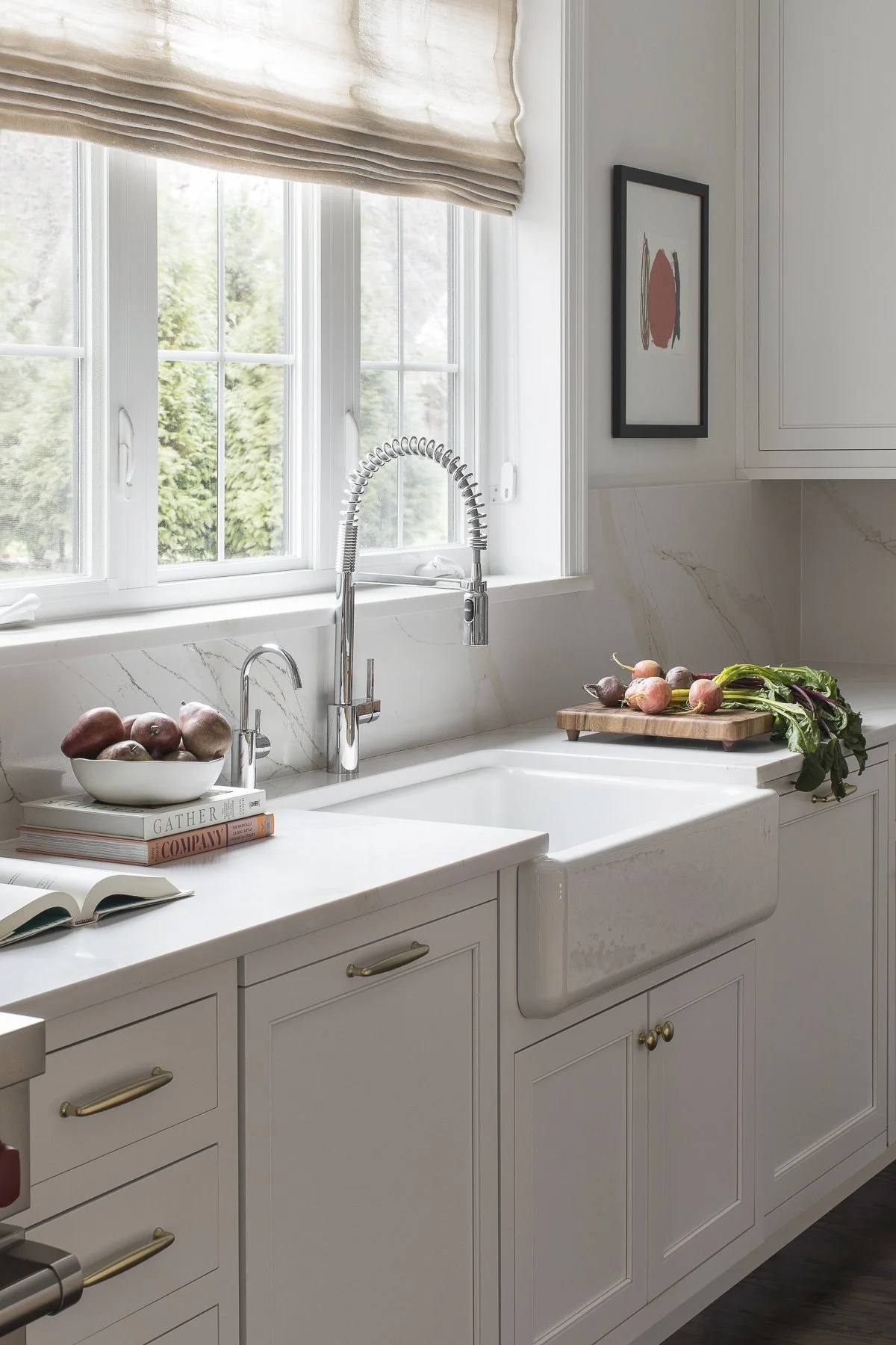 Transitional white inset kitchen with white oak island, professional appliances and a full height backsplash.