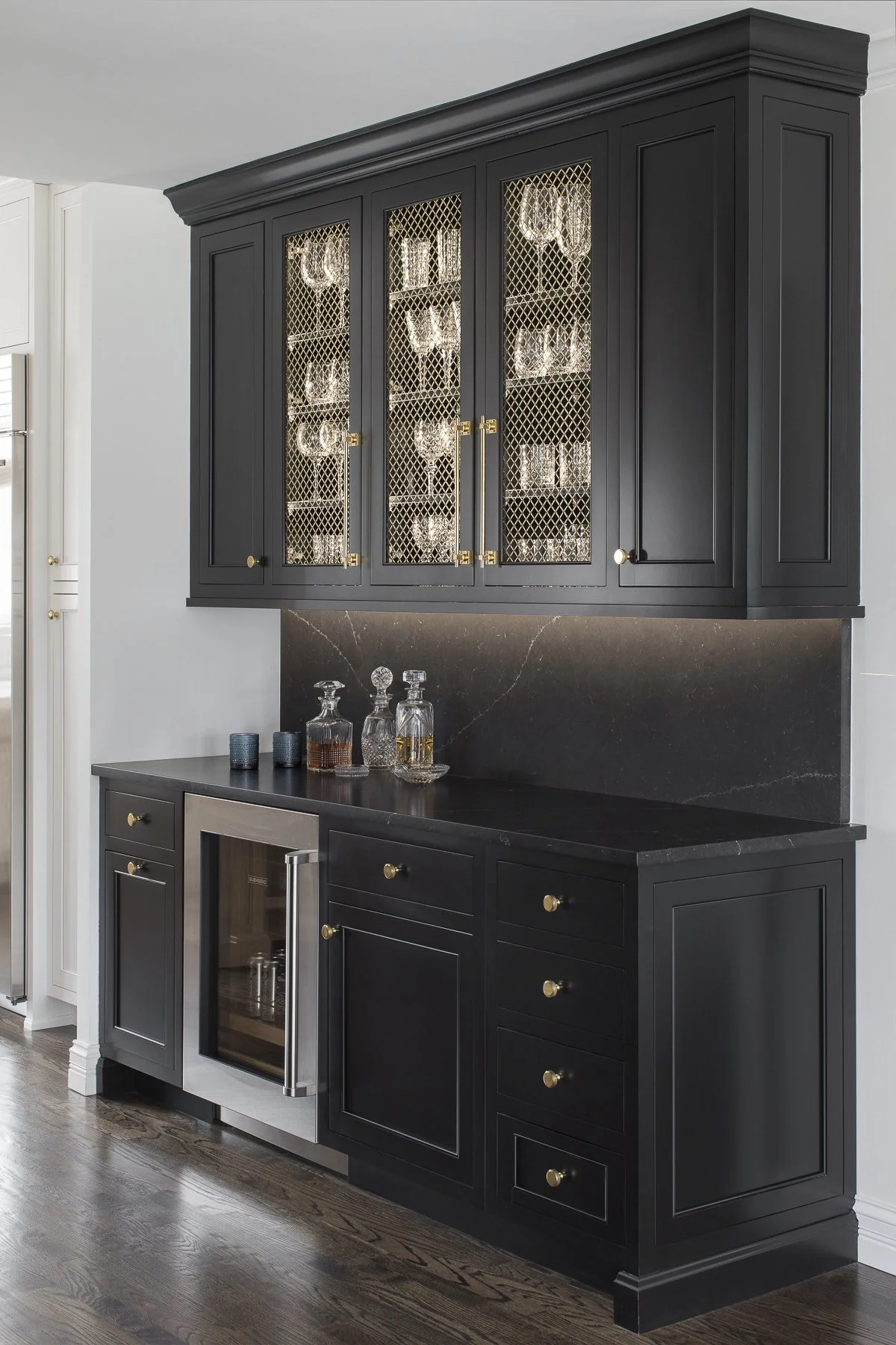 Transitional white inset kitchen with white oak island, professional appliances and a full height backsplash.