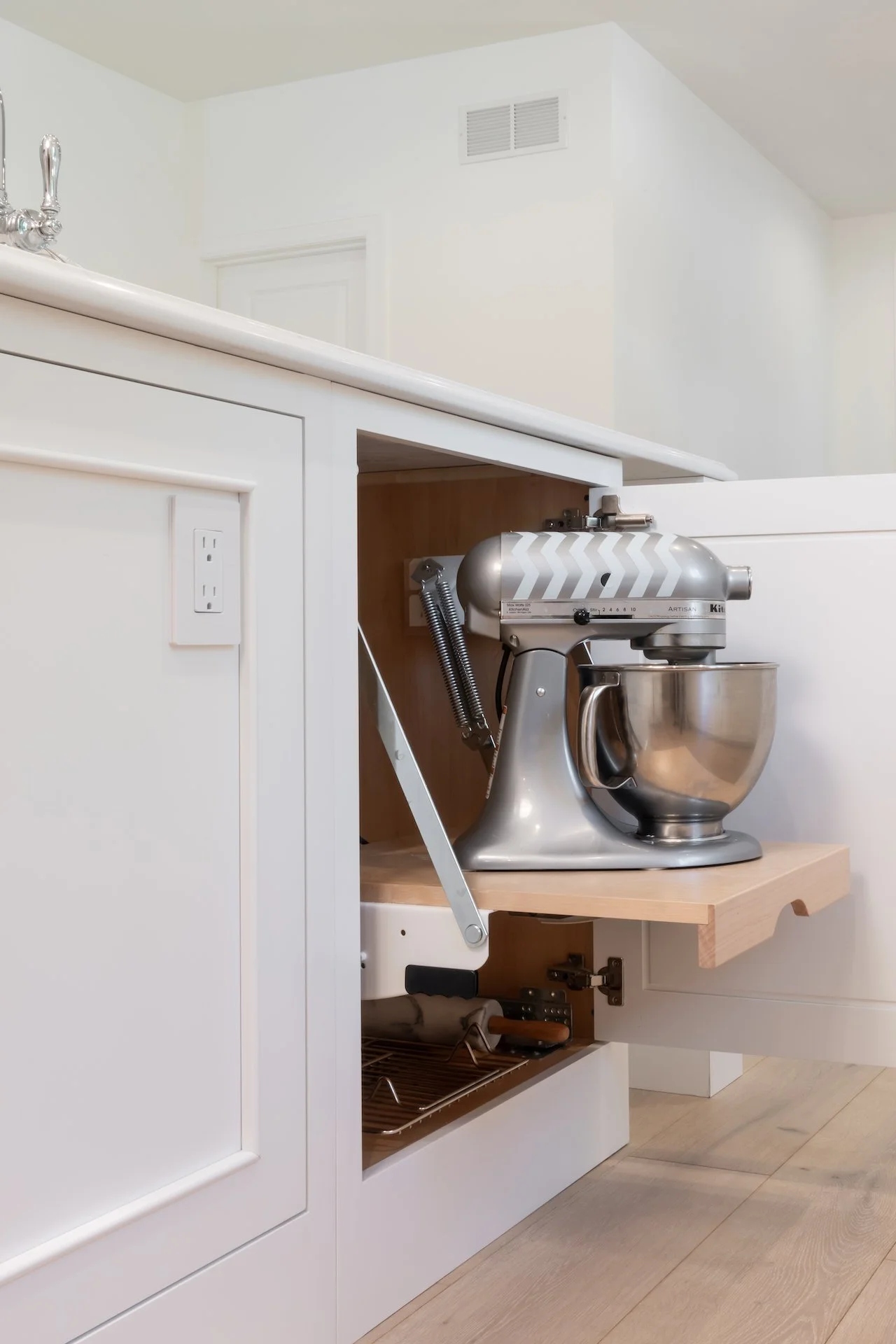 Transitional white inset kitchen with blue bar, professional appliances and brass fixtures. 