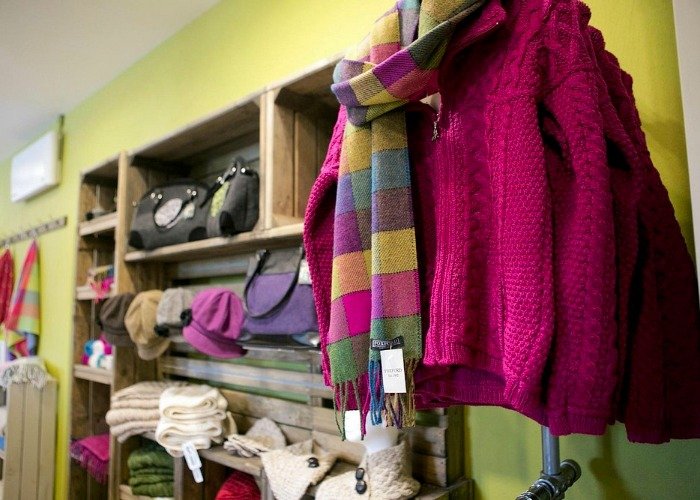 handmade wool scarf and knit sweater display.jpg