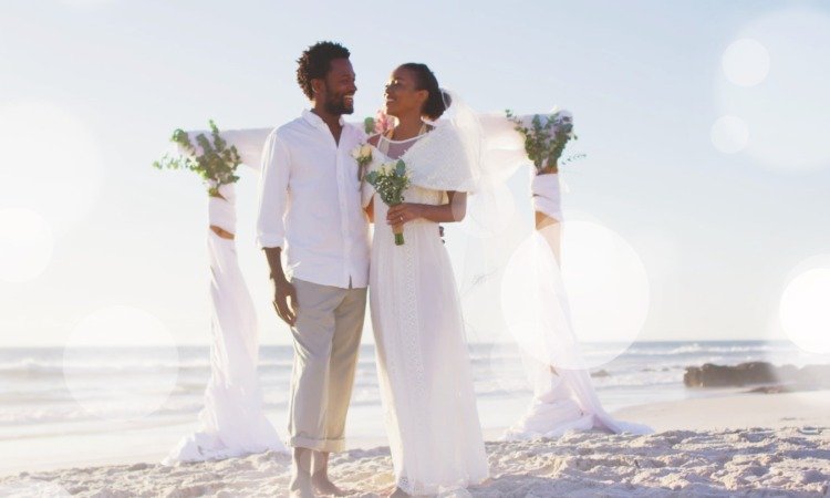 Beach Wedding Bliss Under a Floral Arch.jpeg