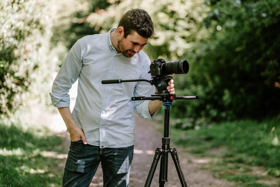 A videographer filming a wedding film