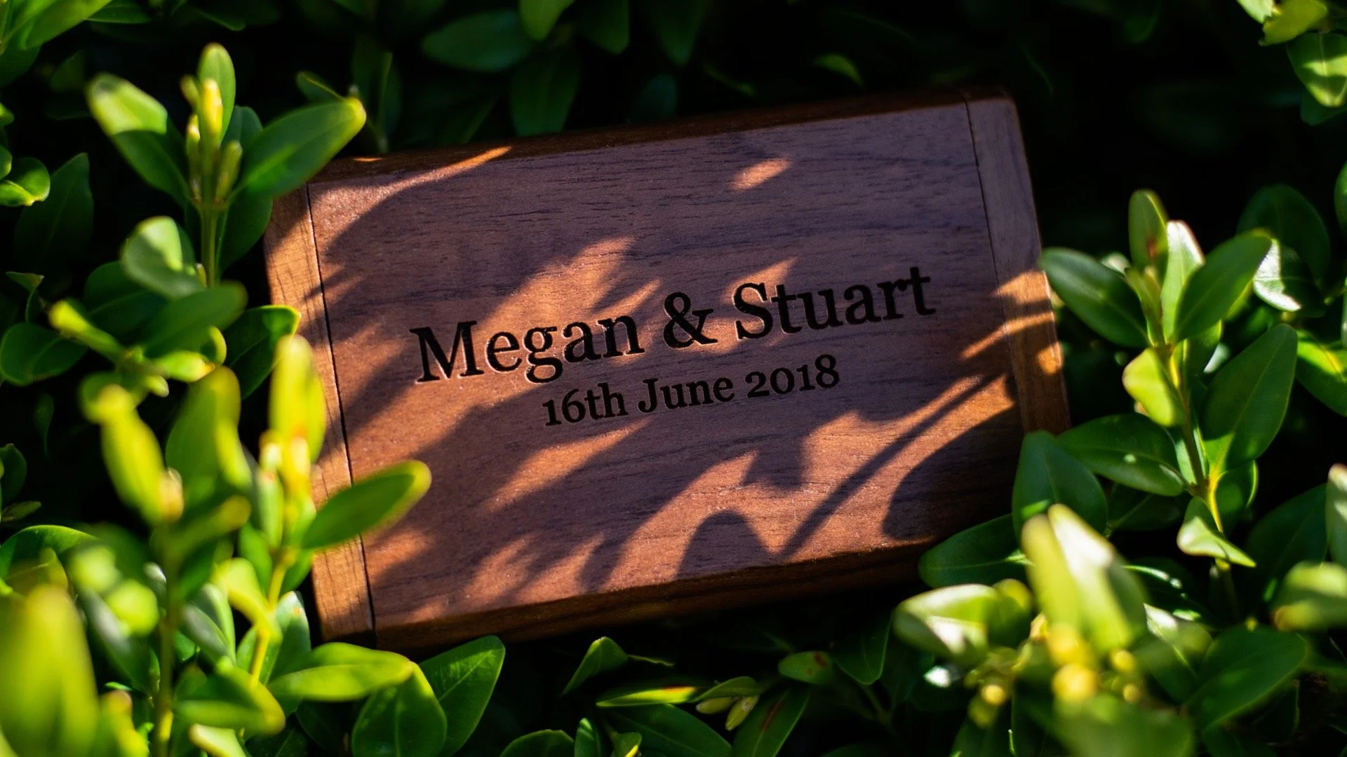 An engraved USB drive containing wedding films