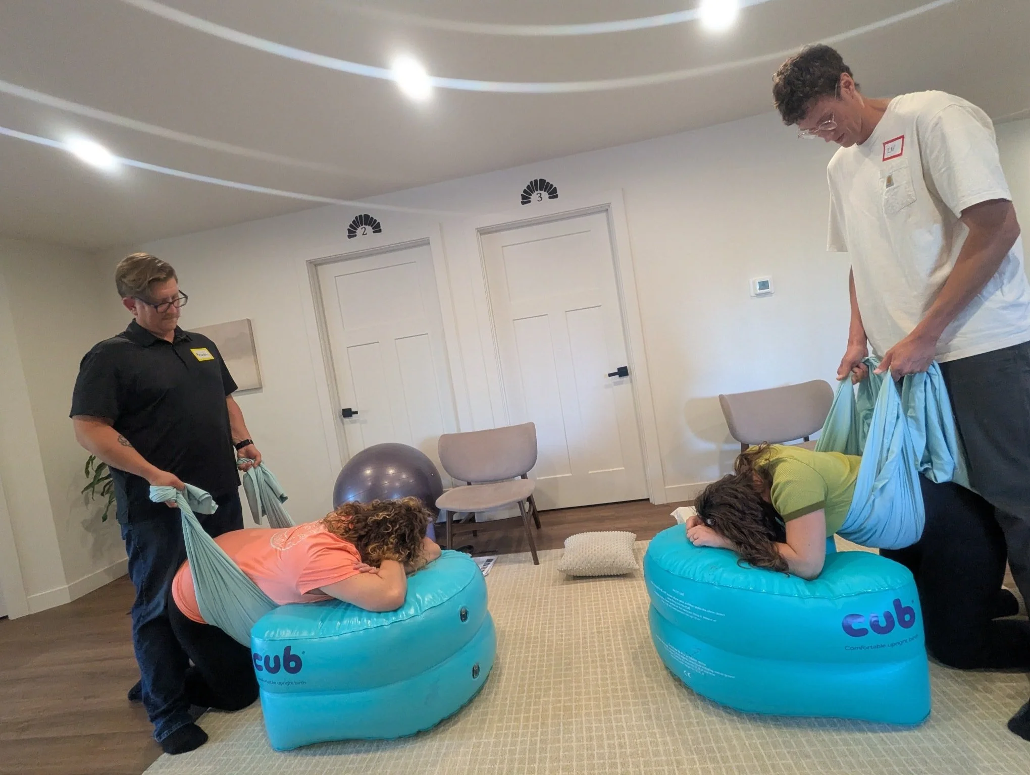 Fun fact: I have a big green inflatable birth tool in my bag, that I bring to every birth as an additional item clients can use. 

This "funky looking thing" is called the "C.U.B" &mdash; Comfortable Upright Birthing!

Every singl