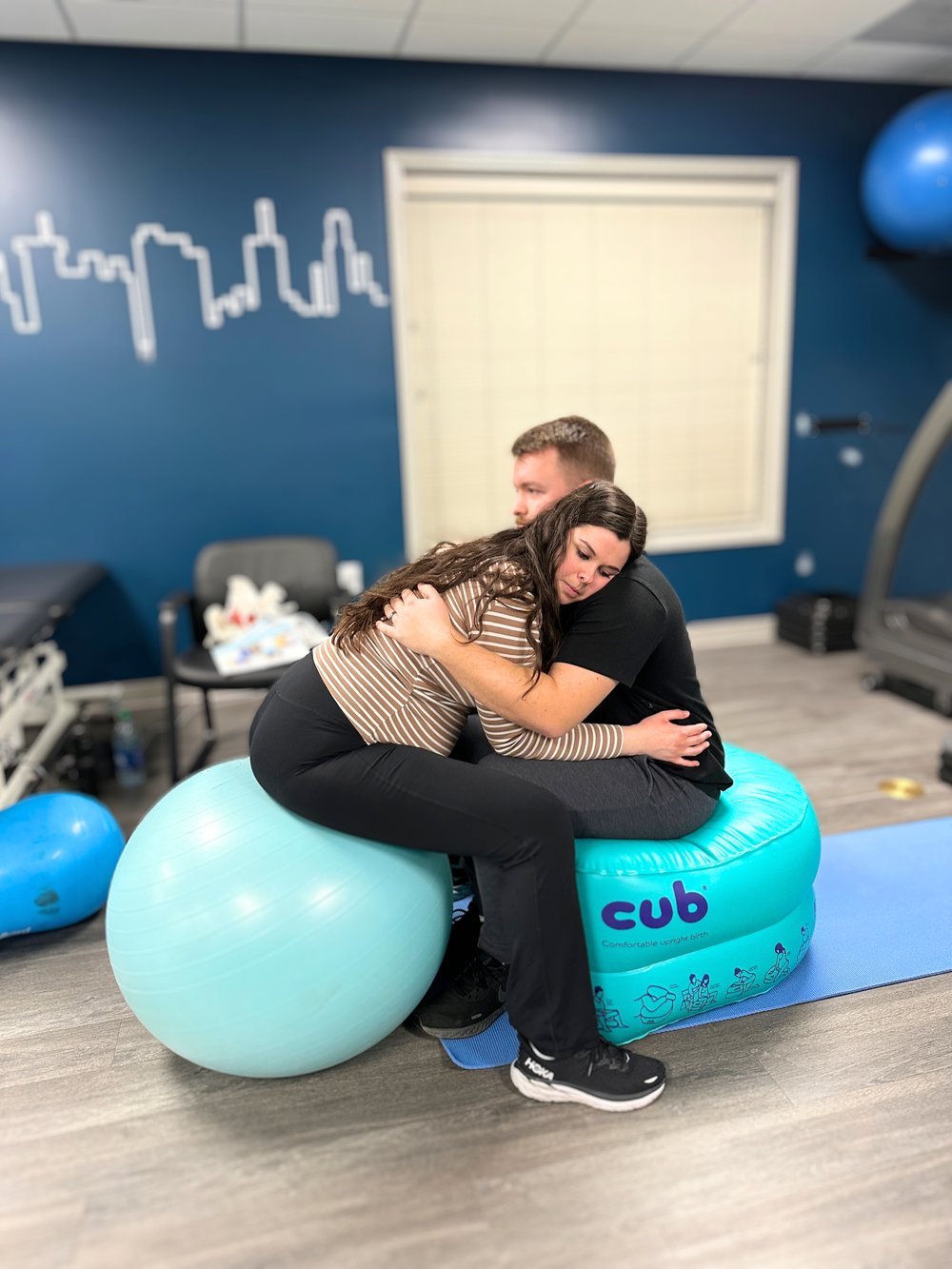A pregnant couple learning comfort measures during Prep4Partner childbirth education class in Marquette County, Michigan.
