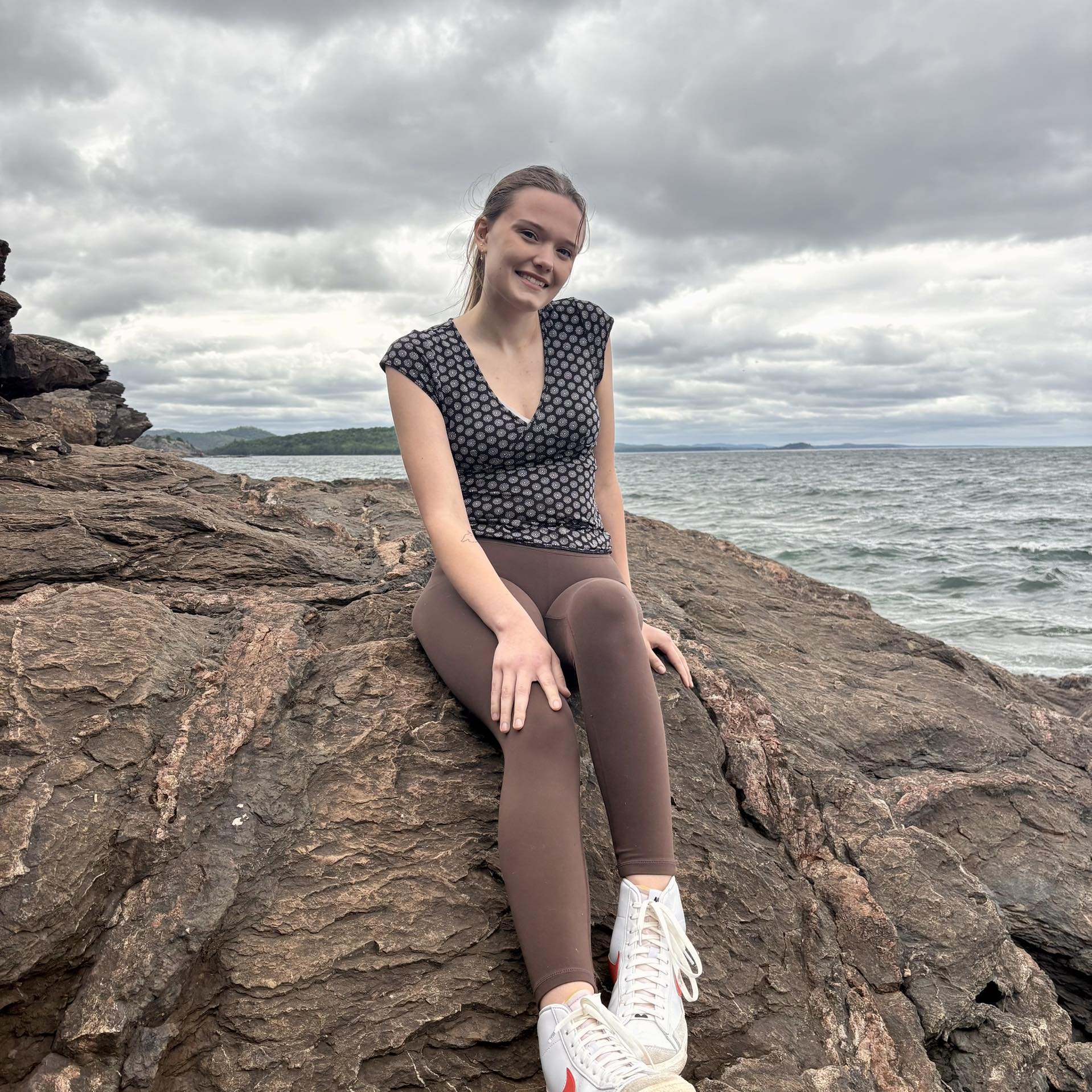 Postpartum doula Grace Anderson poses for professional photo in Michigan's Upper Peninsula.