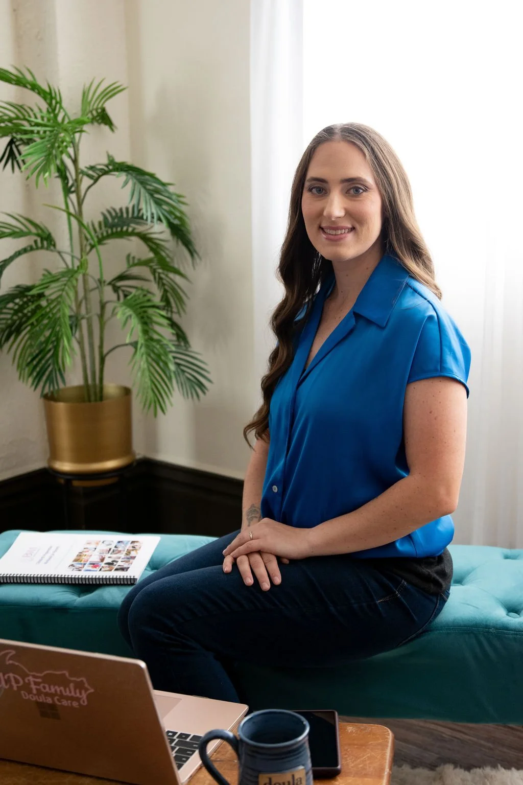 Lacy Anderson, certified birth doula and owner of UP Family Doula Care, posing for professional photo in Marquette, MI.