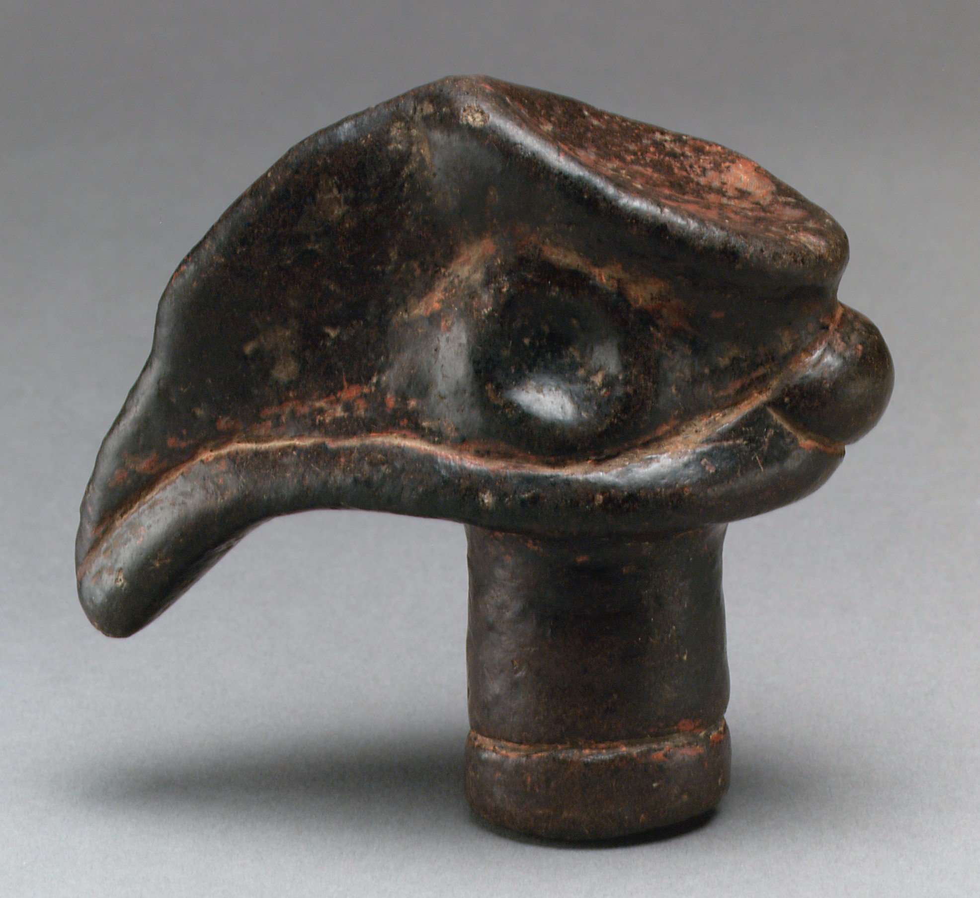 Prehistoric carved stone object possibly representing a bird’s head