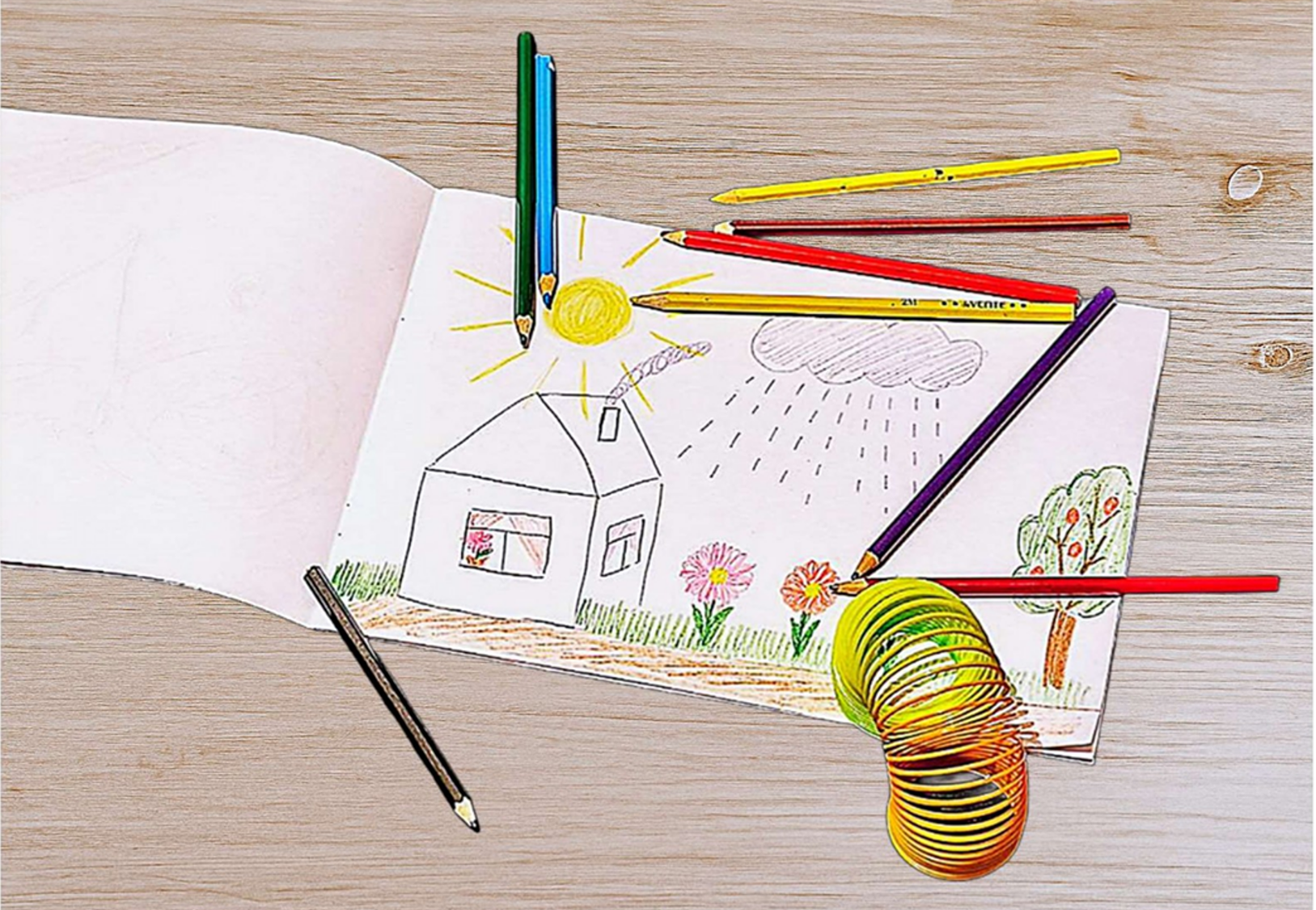 Image of a child's drawing of a house in a garden with big sun and rain cloud, colored pencils, rainbow slinky