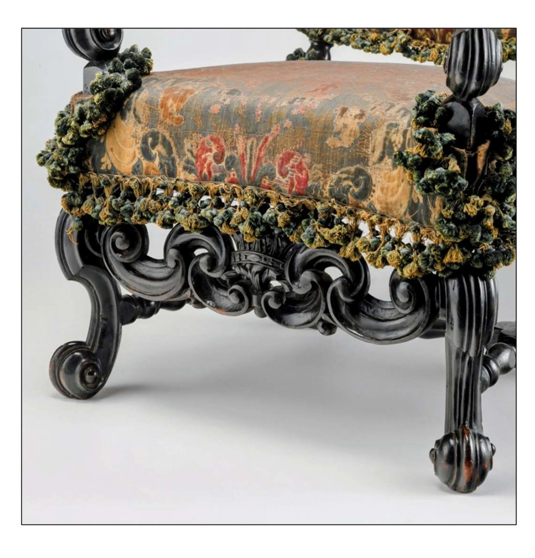 Detail of the front stretcher and passementerie, showing the quality, depth,  movement of carving and trim.