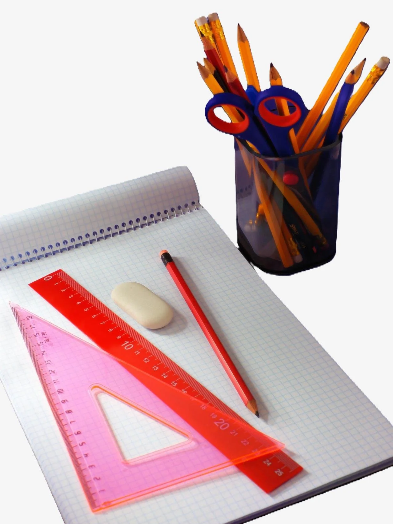 Pad of graph paper with triangle, ruler, pencil, eraser and pencil holder with pencils, scissors